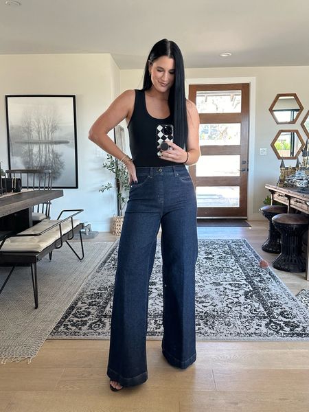 New favorite wide leg jeans!!
Use code DTKxSPANX for 10% off your entire spanx order!

I’m in the size medium regular length. Size up because these jeans do run small.

My black bodysuit is from nuuds and I’m wearing a small.



#LTKstyletip #LTKworkwear #LTKfindsunder100
