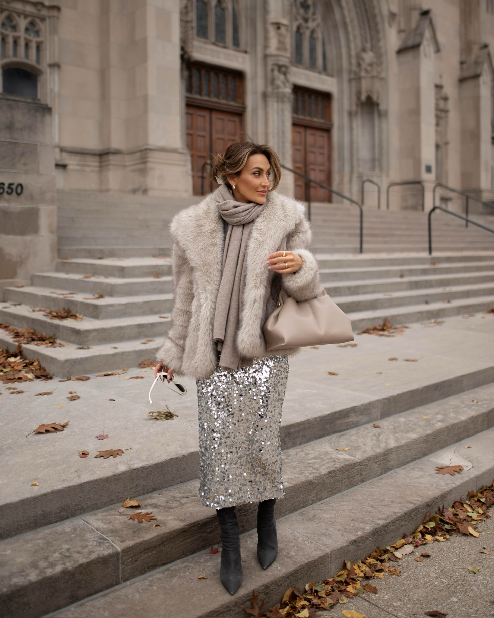 A holiday outfit idea for all of your seasonal events ✨ This sequin skirt makes for the ultimate holiday wardrobe staple — it’s versatile, comfy, and doesn’t break the bank. Style it with a simple crewneck sweater and a faux fur jacket for a festive and upscale look. Add knee high boots or a pair of heels depending on the occasion. Oh, and don’t forget just how much a scarf and some jewelry can dress things up! 

#LTKStyleTip #LTKSeasonal #LTKHoliday