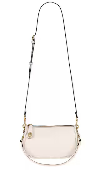 Coach Swinger Bag in Cream. | Revolve Clothing (Global)