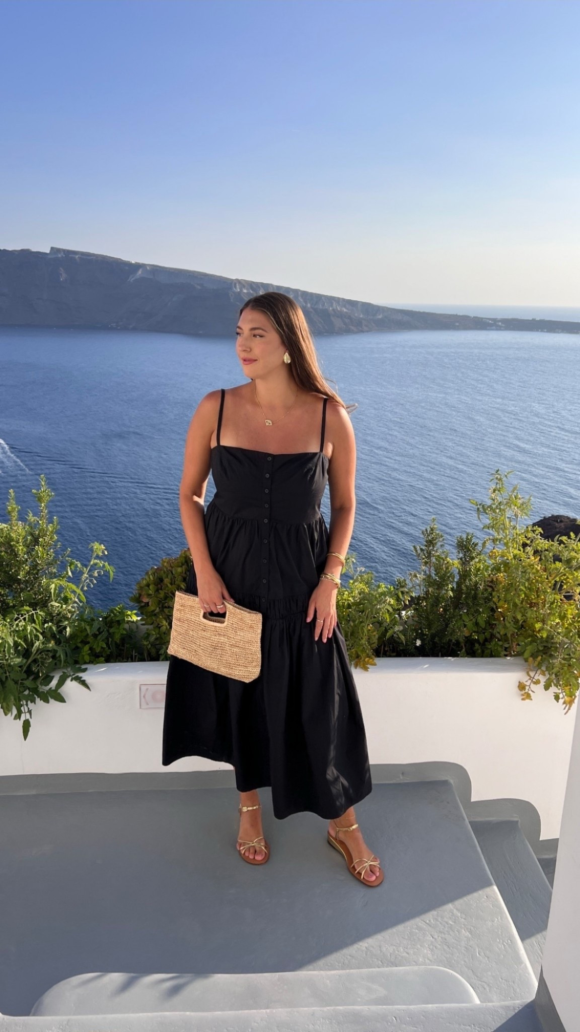 Black dress, golden hour, and the bluest water I’ve ever seen 🌊✨ this is exactly why I always pack a simple black midi when traveling—timeless, flattering, and somehow always feels right no matter the destination.

Keywords: black midi dress, vacation outfit, European summer style, travel outfit ideas, Santorini style, coastal chic outfit, summer dress outfit, straw clutch outfit, effortless vacation look, resort wear inspiration

#LTKootd #LTKValentine #LTKMidsize