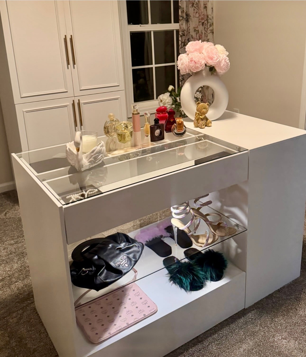This island in my dressing room is such a beautiful addition . So much room to display sunglasses, jewelry , perfume or whatever you like. On the side much more storage available. Several drawers allow you to store scarfs, make up or whatever else you want . 

#LTKselfcare #LTKSaleAlert #LTKHome