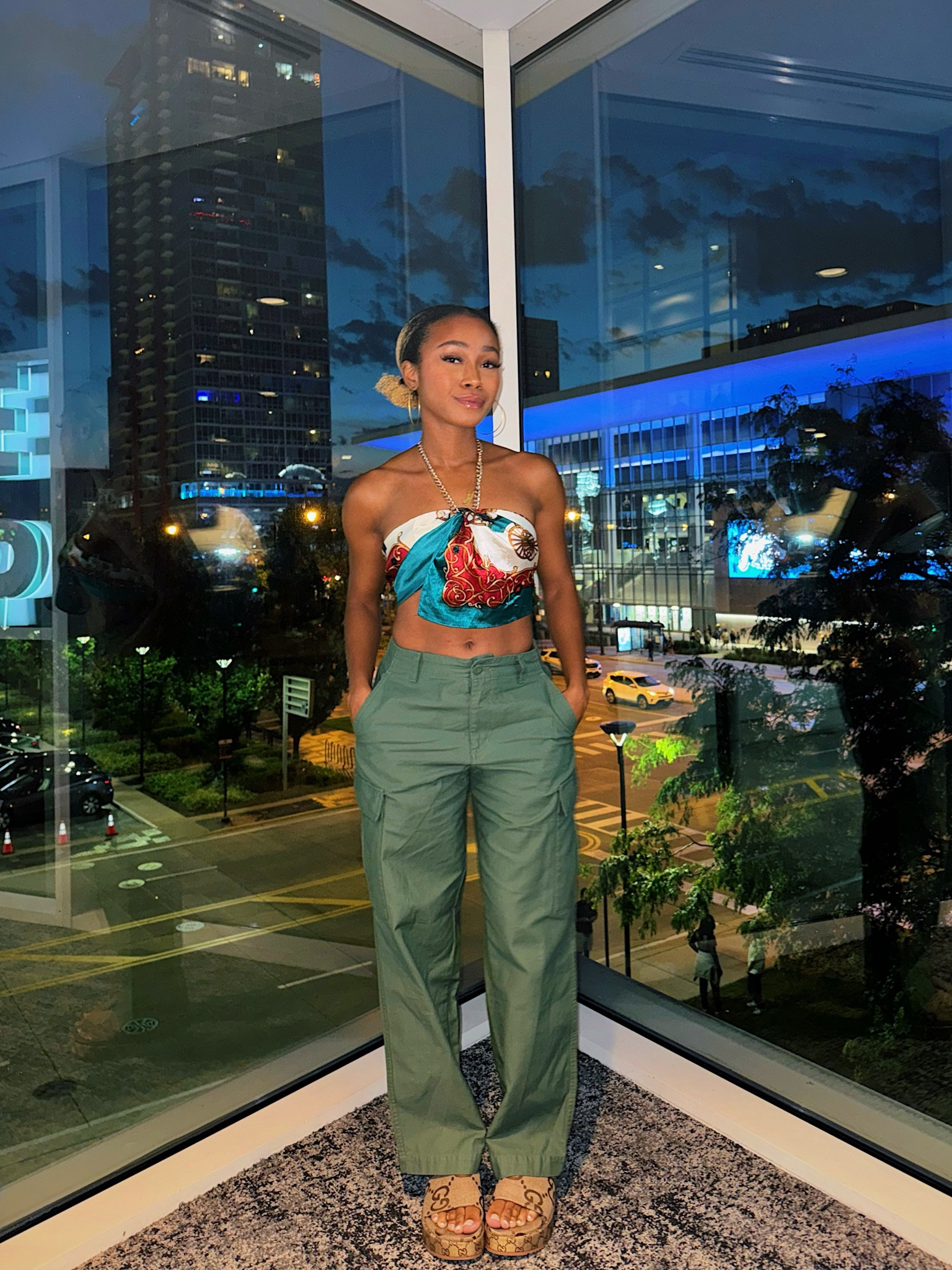 Went to a basketball game got to see Angel Reese kill it! 🏀 
 officially became a Reese’s Piece

Styled my green cargos with a scarf I tied into a top through my necklace 💚

#LTKBeauty #LTKParties #LTKSummerSales