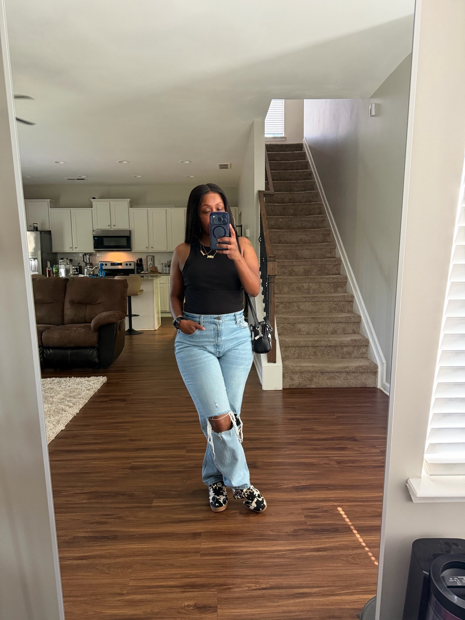 How I style black racerback tank top with high rise Abercrombie & Fitch distressed jeans

#LTKootd #LTKOver40 #LTKPetite