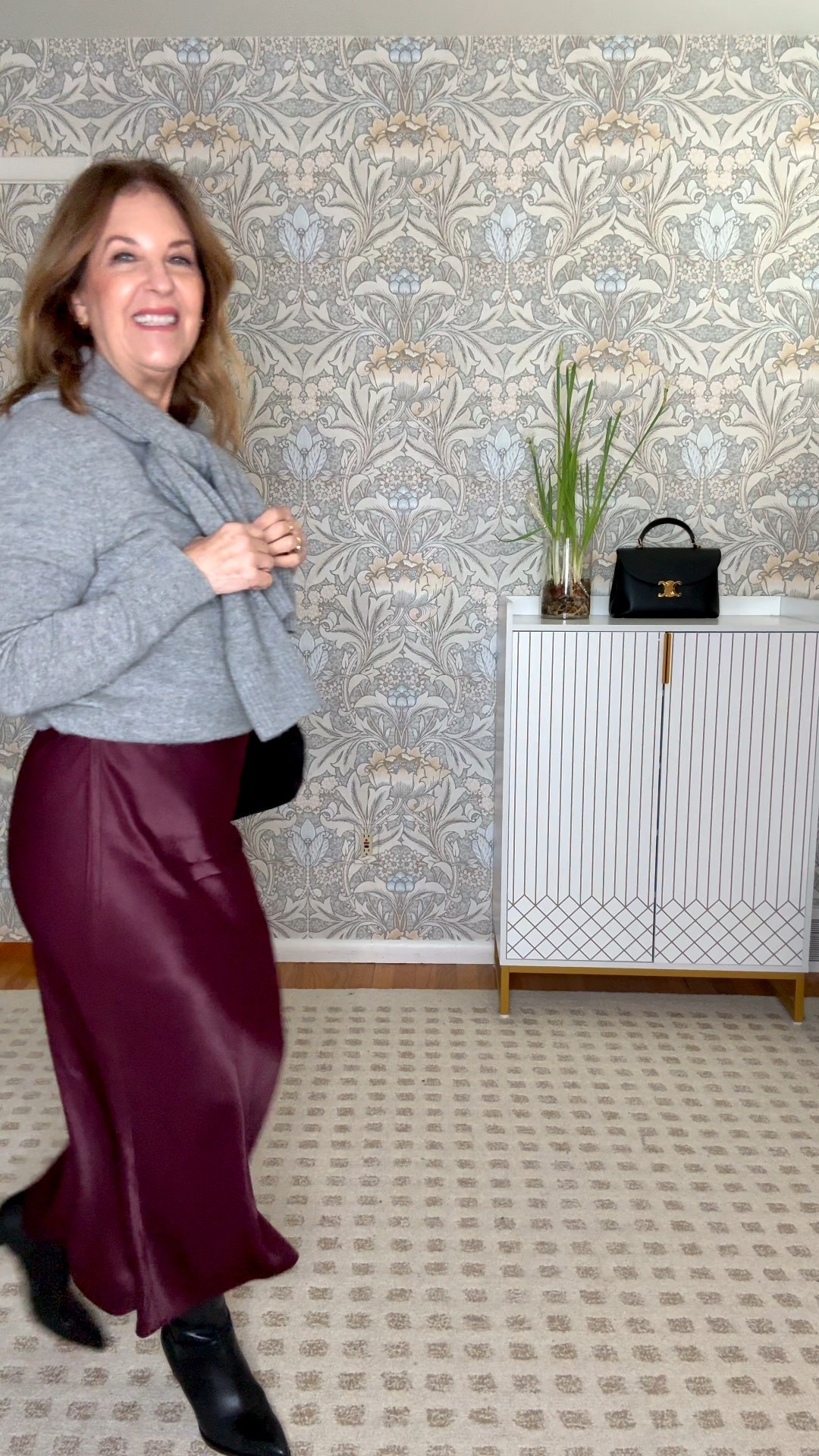 Wear grey cashmere and boots with a slip skirt for another holiday look. 

#LTKOver40 #LTKFindsUnder100 #LTKHoliday