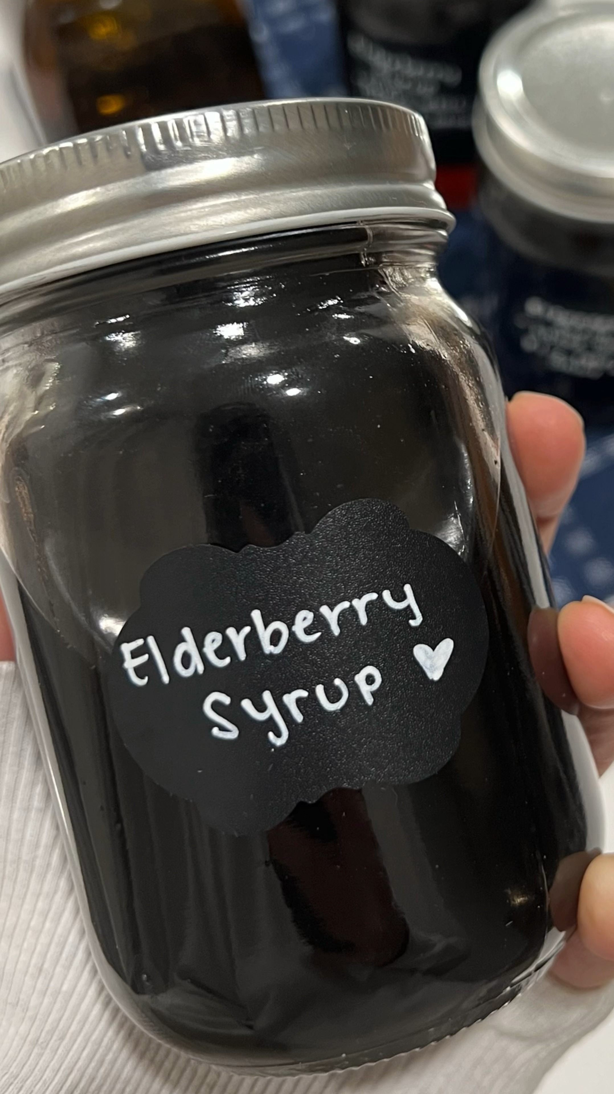 ELDERBERRY SYRUP
Handmade Christmas gifts you can make. 🤍 share this with a friend! 🤍

This DIY elderberry syrup is sure to be a hit with your friends and family! Consider creating a winter wellness gift basket with tea, elderberry syrup, and a jar of raw local honey. 

This also make a fun moms night idea!

Learn how to make elderberry syrup using this Elderberry Syrup Recipe 👇🏻👇🏻

INGREDIENTS
* 4 1/2 cups filtered water
* 1 cup Organic Elderberries
* 2 inches fresh ginger diced
* 2 cinnamon sticks (Or 1 Tablespoon ground cinnamon)
* 3-5 cloves
* 1 sliced orange *optional*
* 1/4 - 1/2 cup raw local honey

INSTRUCTIONS
1. In a medium saucepan, combine the water, dried elderberries, cinnamon sticks, clove, and ginger
* Heat on medium heat until the mixture starts to boil. Reduce heat to simmer and cover with a lid.
* Simmer for about 45 min - 1 hour, stirring occasionally.
* Remove from heat and allow it to cool. Pour the syrup through a strainer into a glass bowl. Use the back of a spoon to squeeze any remaining juice out of the berries. Discard the elderberries.
* Pour in to a jar with honey. For sweeter syrup, use 1/2 cup.

#LTKHoliday #LTKGiftGuide