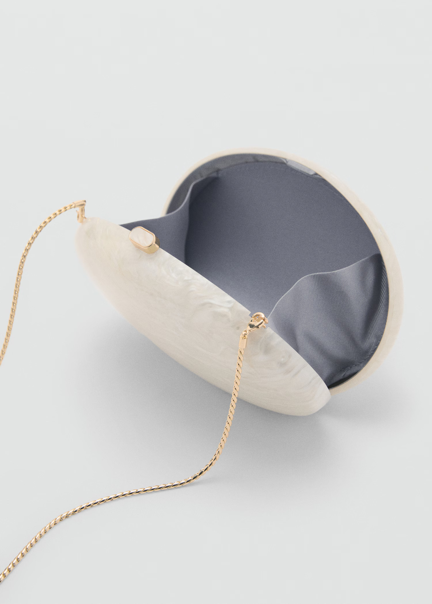 Oval clutch bag - Women | MANGO USA | Mango (US/MX/AU)