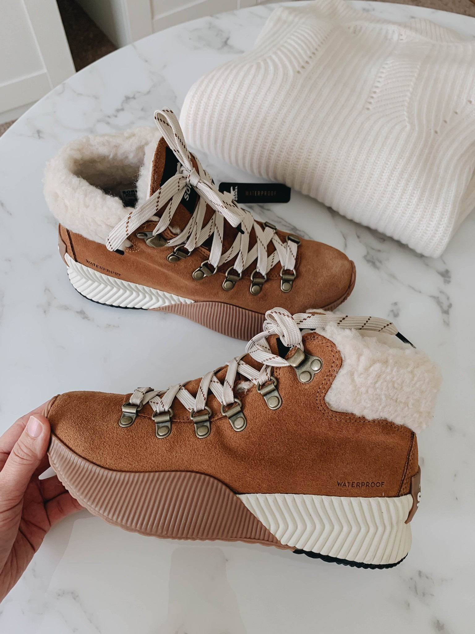 Sorel waterproof boots- on sale! Run TTS. Love that these are a sneaker/boot hybrid. Lightweight and comfortable. 

Winter boots. Snow boots. Capsule winter wardrobe. Best winter boots on sale. 

#LTKsalealert #LTKshoecrush #LTKSeasonal