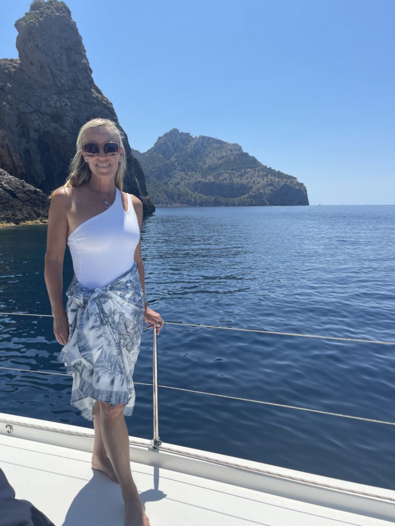 Love this classic look for the pool, beach or boat day. I’m wearing a white asymmetrical one piece swimsuit with a cutout, a blue and white swimsuit coverup and one of my favorite sunglasses 

#LTKswim #LTKtravel #LTKSeasonal