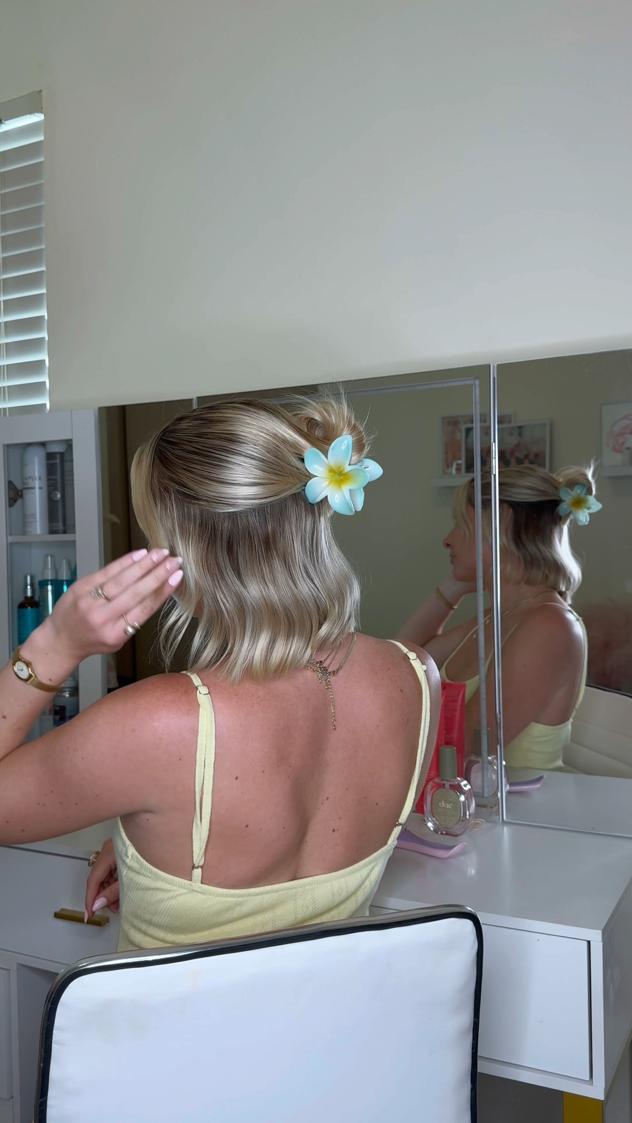 Spring hairstyle for short hair + flower claw clip + slicked back hair products 

#LTKbeauty #LTKSeasonal