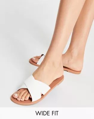 ASOS DESIGN Wide Fit Facts cross strap mule sandals in white | ASOS (Global)