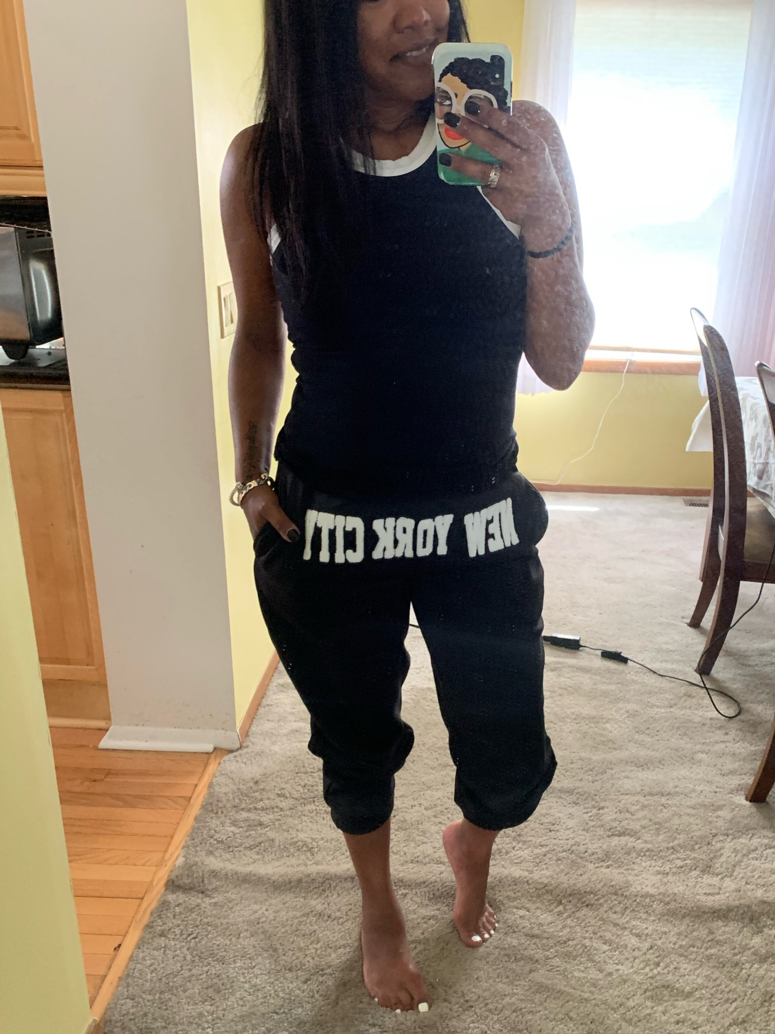 Cute black joggers that say “New York City” on the front.  On sale today for $18.   Tank only $19.  I live for these tanks.  So soft, smooth and stretchy.  They also wash great.  Linking exact pieces for y’all. 💛

#LTKsalealert #LTKfindsunder50 #LTKSale