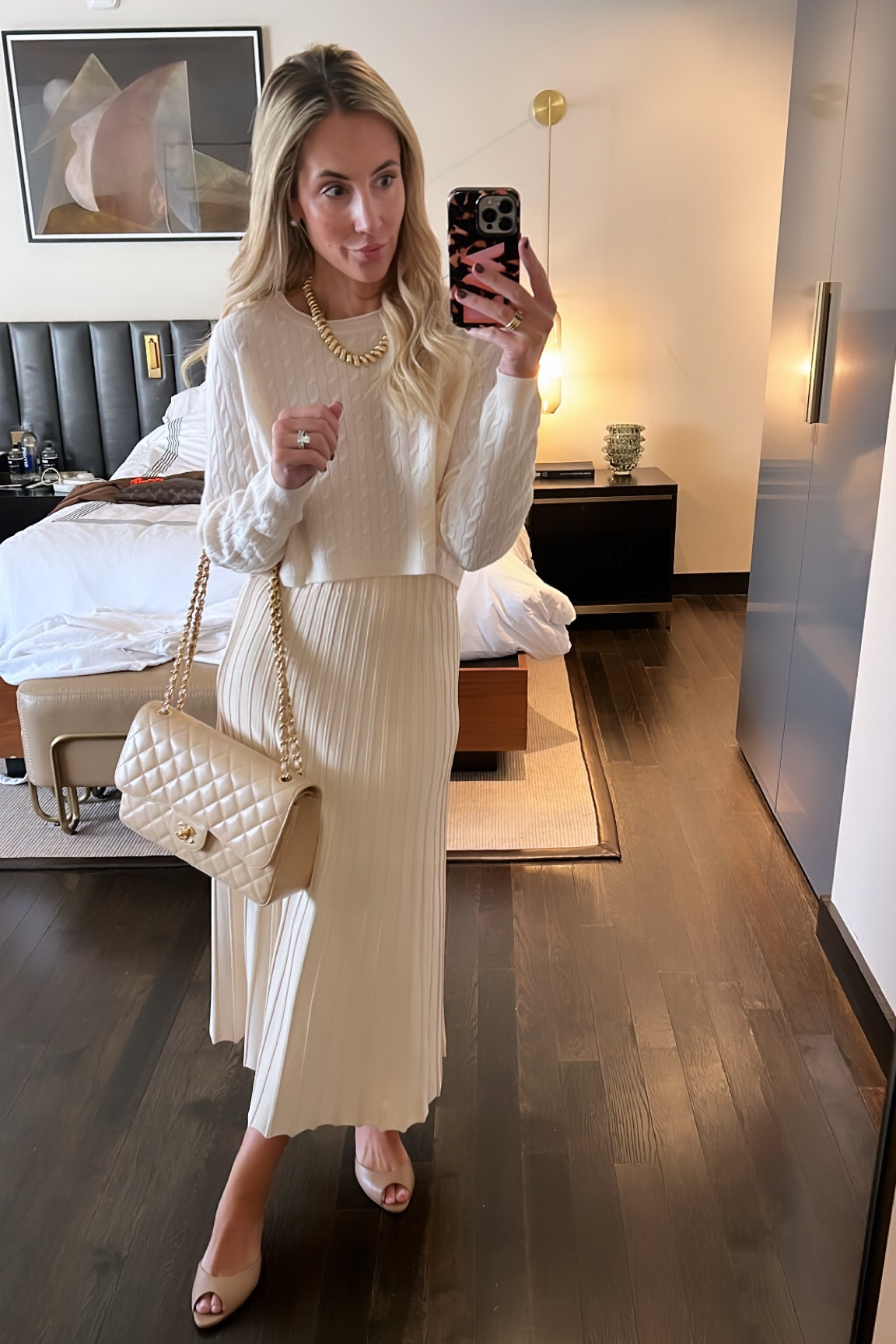 Quiet luxury work day attire 
Cableknit cashmere sweater 
Cream knit modi skirt
Chanel purse
Winter white outfit 

#LTKstyletip