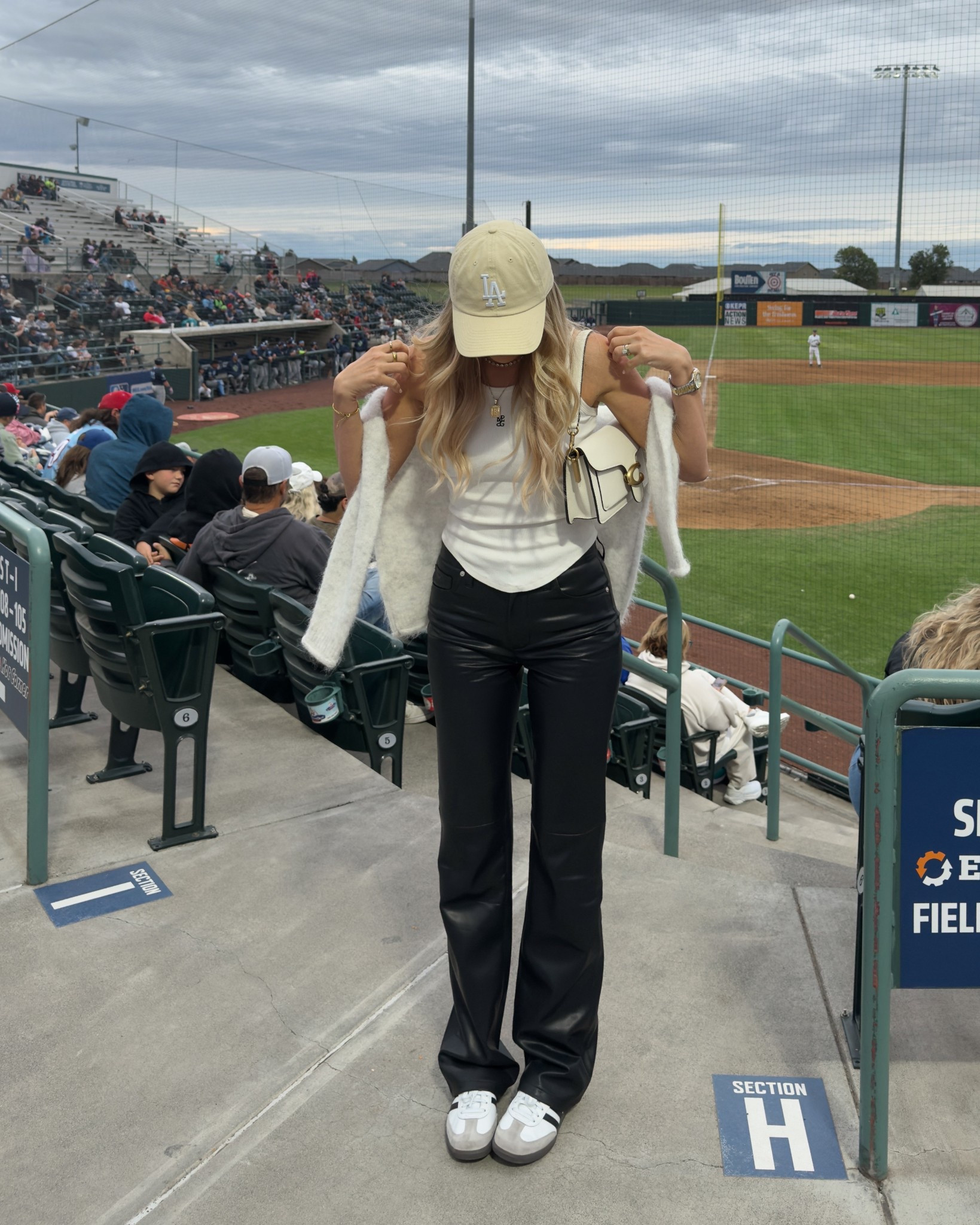 Leather pants outfit, baseball fit ballgame night outfit. Pale yellow cap cashmere sweater coach tabby sambas white tank 

#LTKU #LTKSaleAlert #LTKSummerEdit