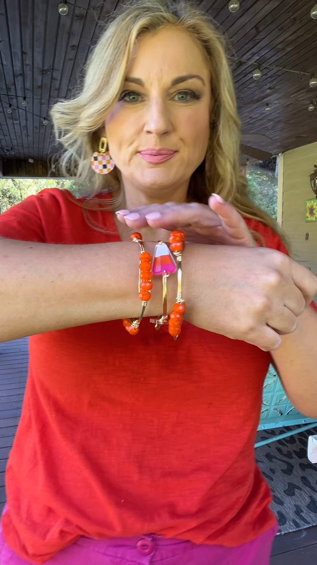 Candy corn bangle bracelet in hot pink and orange surrounded by two orange bangles 

Also great for University if Tennessee fans 

#LTKStyleTip #LTKFindsUnder50 #LTKOver40