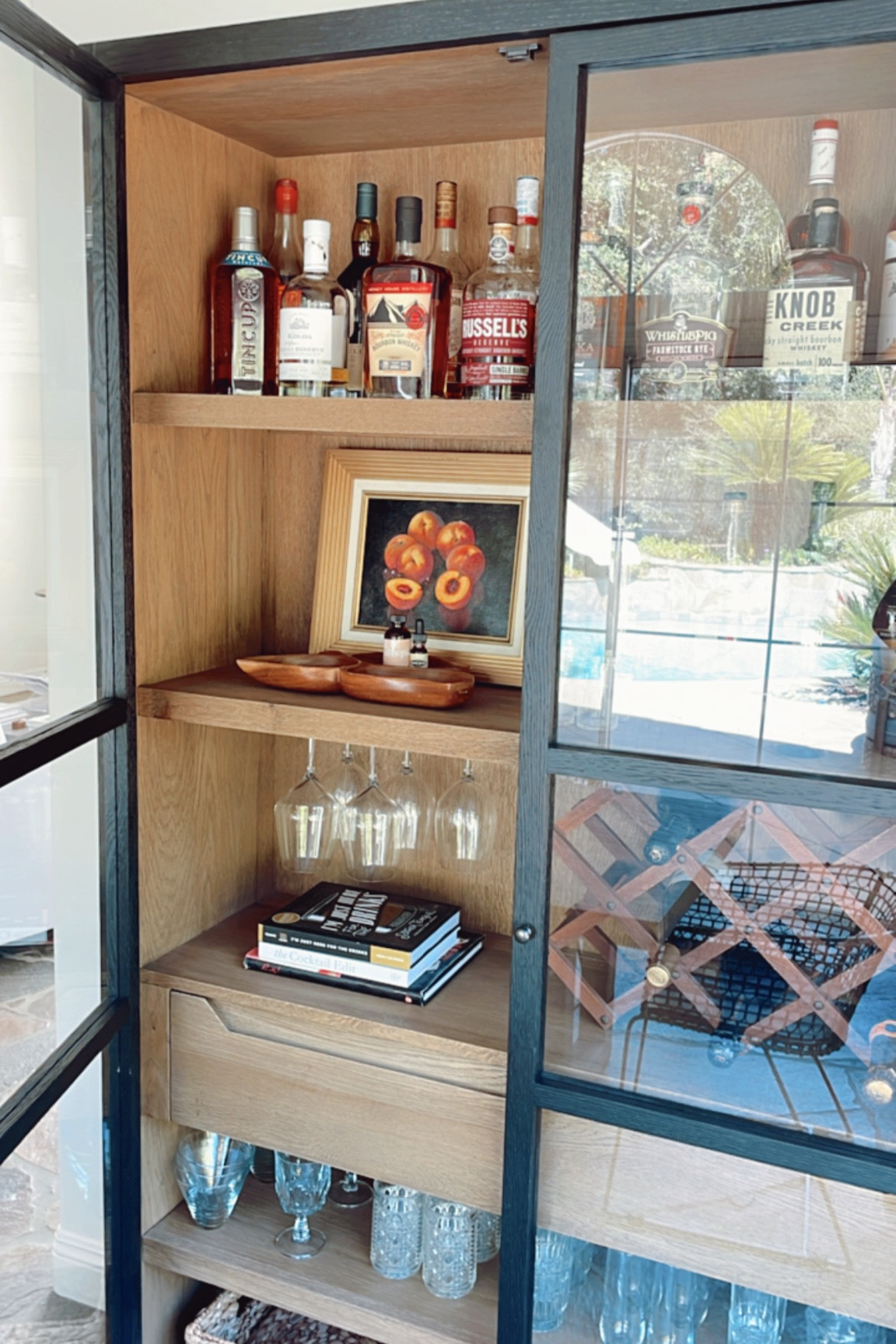 Still loving our bar cabinet + found one that’s really similar for under $800. Also check out the new cocktail recipe books! 

#homebar #curiocabinet #barcabinet #ltkhome
