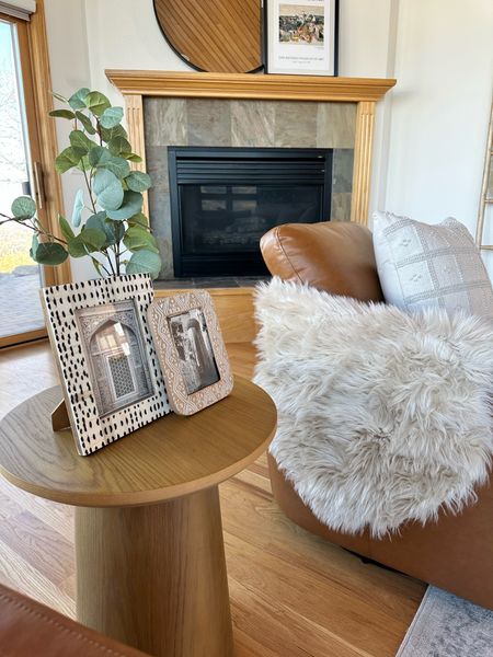 Adding dimension to a living room space can be simple and functional. Furs, frames and fluted tables will do just the trick! 

#LTKhome #LTKFind #LTKfamily
