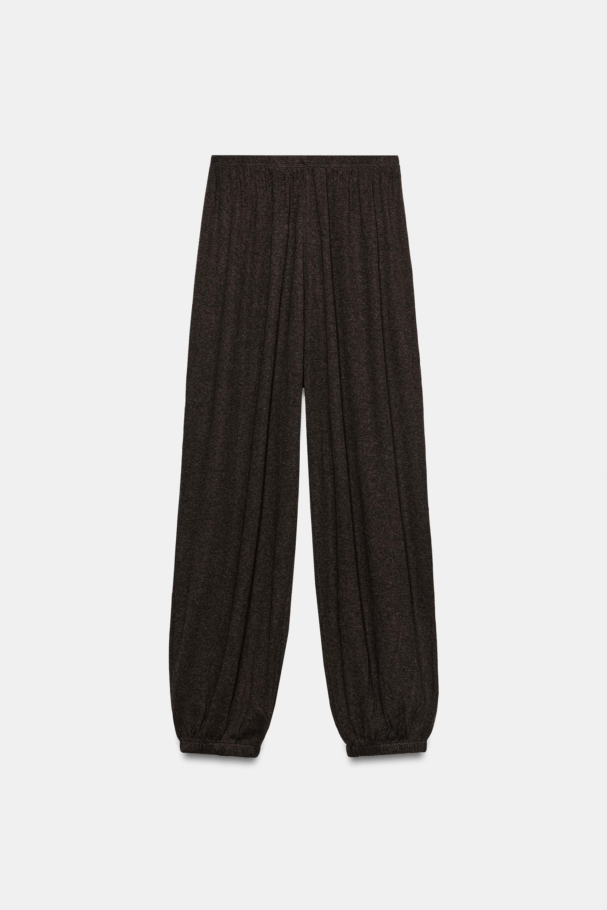 Model height: 173 cmMid-waist trousers with an elastic waistband and elastic cuffed hems. | Zara UK