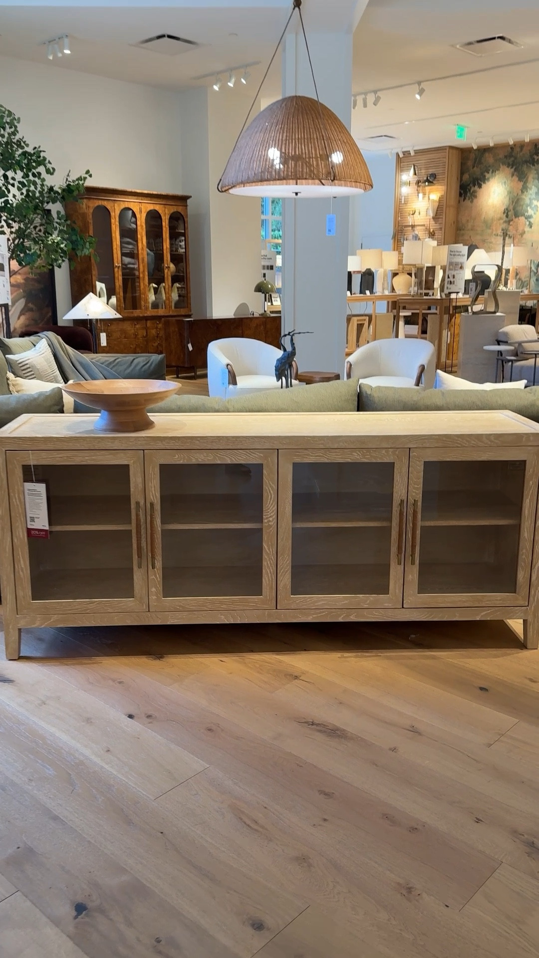 Elevate your space with the Clairemont Natural Wood Storage Media Console from Crate & Barrel — a refined, neutral statement piece that blends clean design with thoughtful craftsmanship. 🤩 The driftwood finish with ivory cerusing highlights the oak’s natural grain, while the glass-front cabinets and brass, leather-wrapped pulls add a subtle, high-end touch.✨ With adjustable shelving, magnetic closures, and built-in cord management, it offers function and style in one streamlined piece. Perfect as a sideboard, media console, or entryway credenza. 🤎 #CrateAndBarrel #Sideboard  #HomeDecorInspo

#LTKHome #LTKSaleAlert