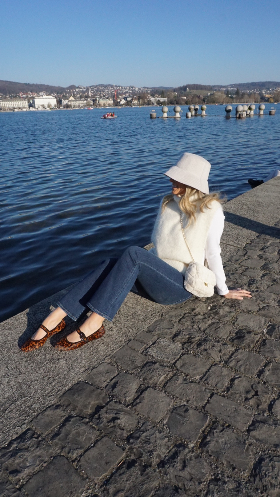 Loving walking around Zurich and seeing all of the beautiful lake views! Wearing a great long sleeve tee that is under $15, some jeans that fit like designer for $50, the cutest flats that are SO comfy for walking around the city, and a chic winter bucket hat!

#LTKFindsUnder50 #LTKTravel #LTKWatchNow