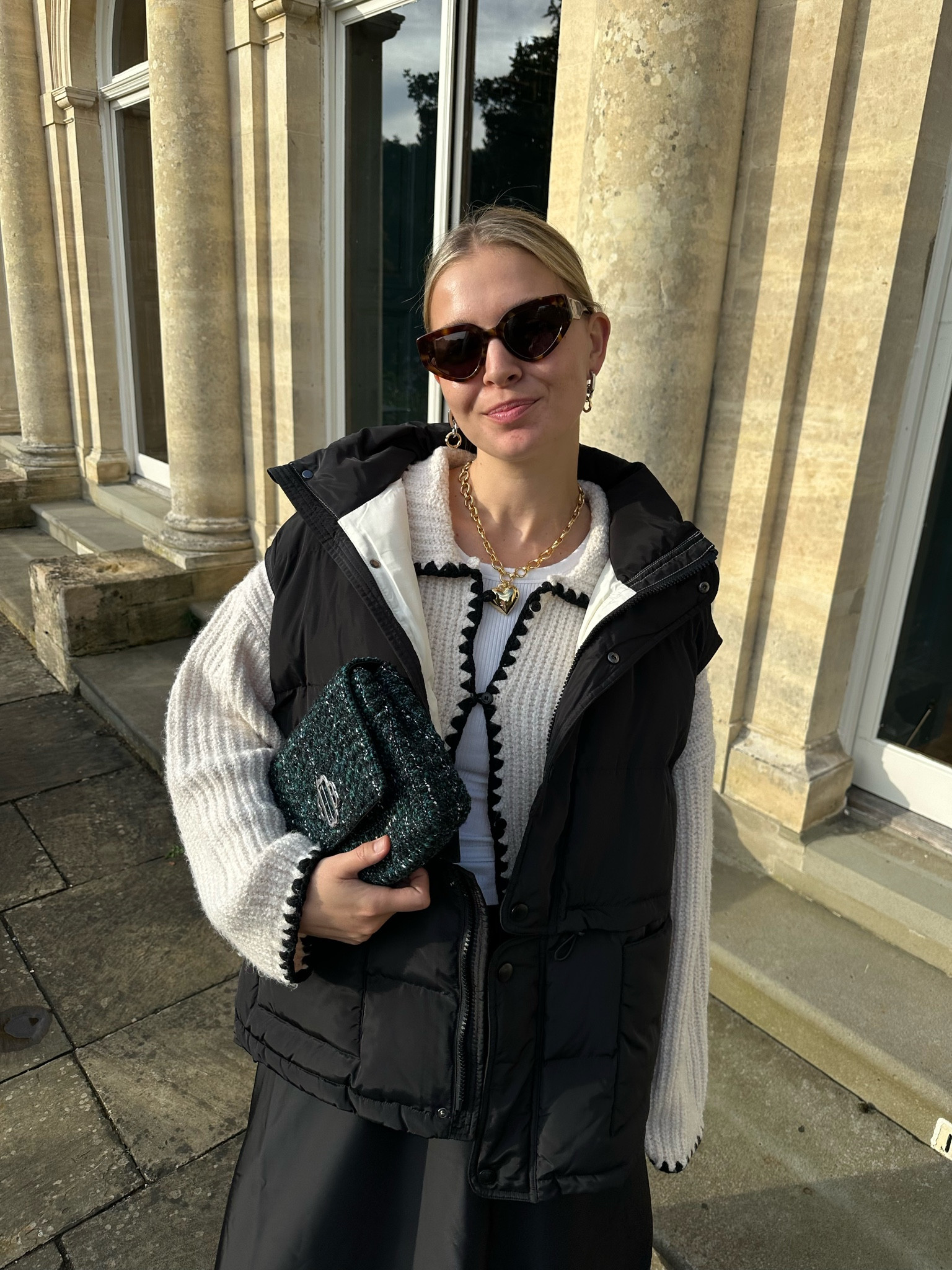 Cotswolds with Maje outfit look 

outfit inspiration, fall outfit, tweed bag, sleeveless puffer jacket, Arket, Bimba y Lola, black midi skirt, knitted cardigan, tortoise shell sunglasses, gold heart necklace. 

#LTKeurope #LTKstyletip #LTKSeasonal