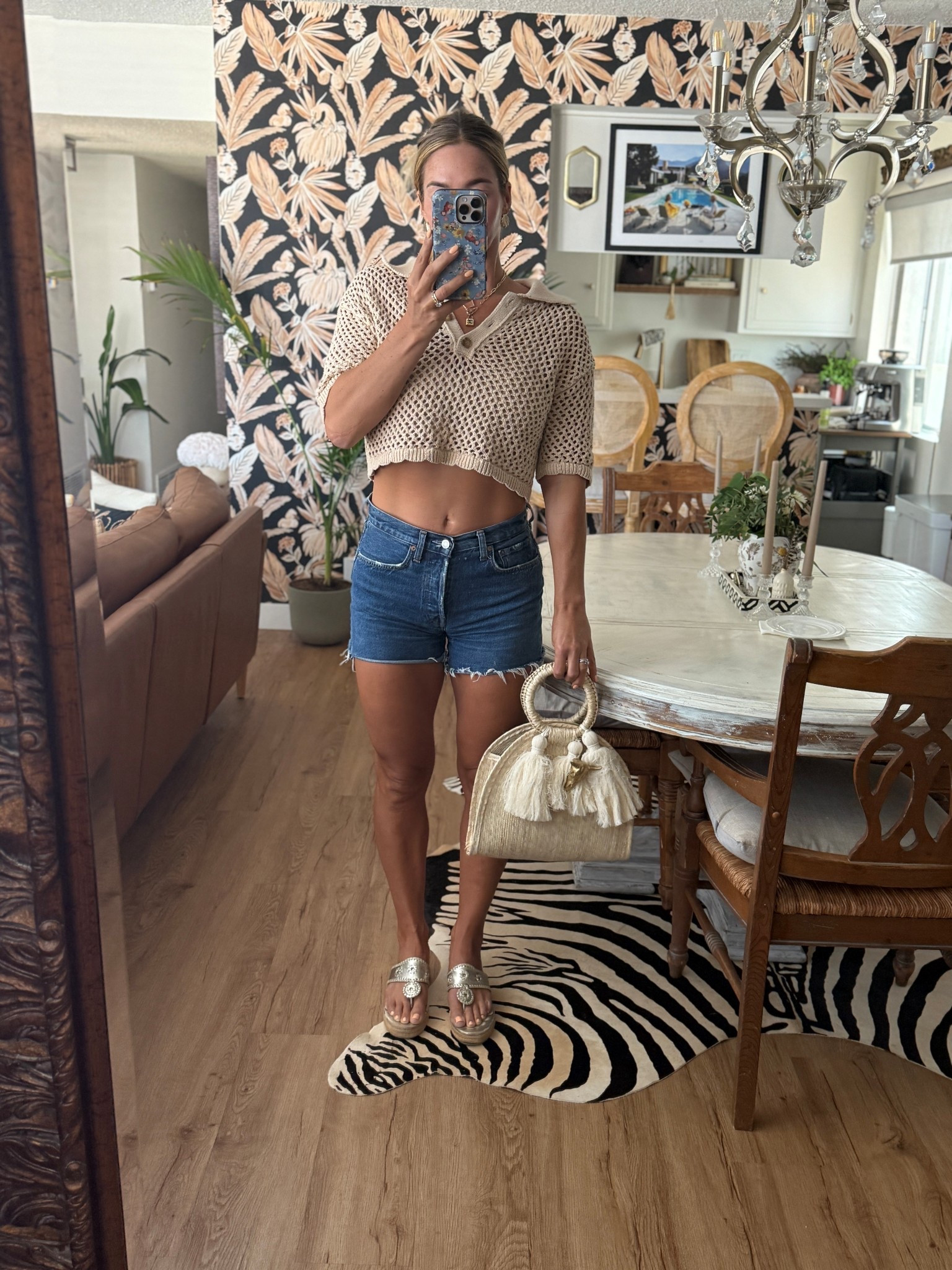 Beachy summer style featuring a cropped crochet polo, denim shorts, a woven straw tote bag, and some gold espadrilles! 