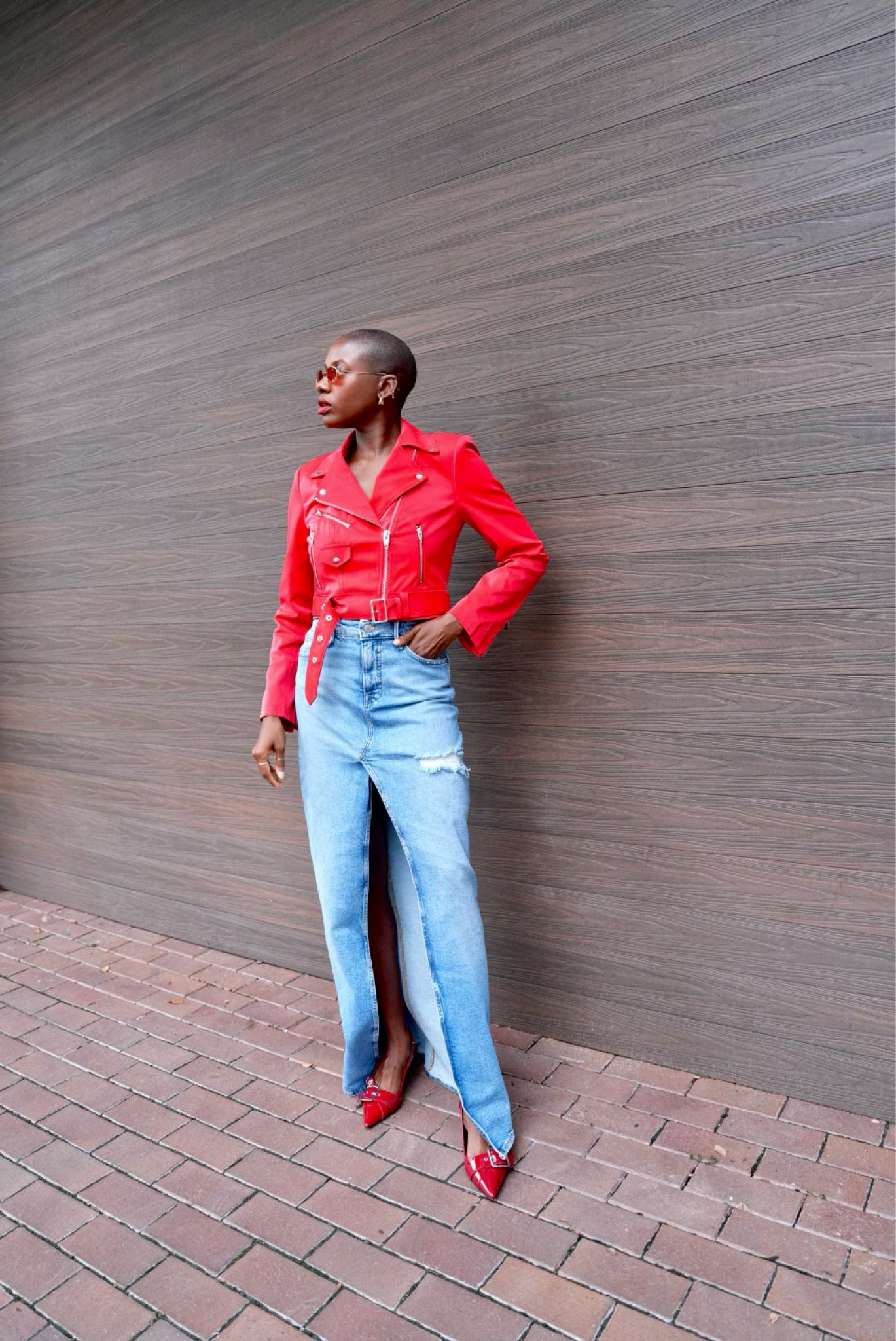 Find outfit! Red faux leather moto jacket, denim maxi skirt with front split with red pointed toe sling back kitten heels & red sunglasses  

#LTKShoeCrush #LTKStyleTip #LTKNYFW