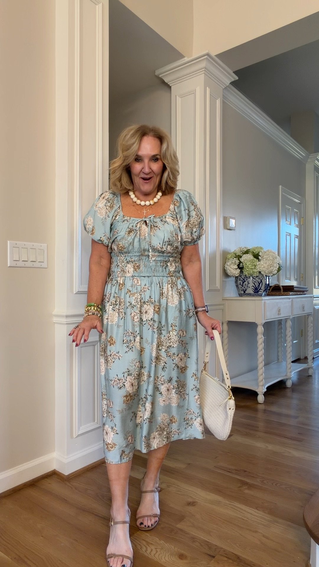 Spa blue floral dress wearing a medium petite
The neck line is a titch wide. I will probably need to put in a little micro stitch to hold it in place so it doesn’t show 
Sandals are true to size their leg, lengthening, and very delicate looking
20% off my bracelets with code NANETTE20￼

Easter dress shower, dress blue floral vacation dress spring break wedding shower

#LTKSaleAlert #LTKSeasonal #LTKOver40