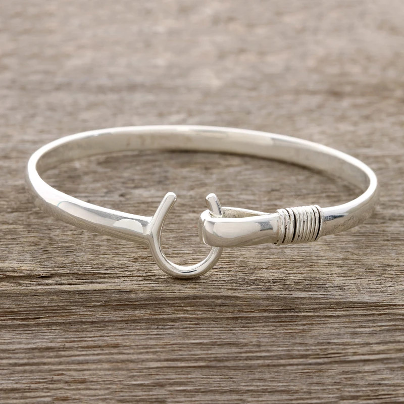 Sterling silver bangle bracelet, 'Horseshoe Fortune' | NOVICA