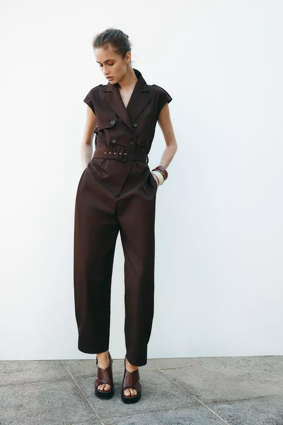 Sleeveless jumpsuit with lapel collar and tab and button detail. Elastic waist in the back and ma... | Zara US