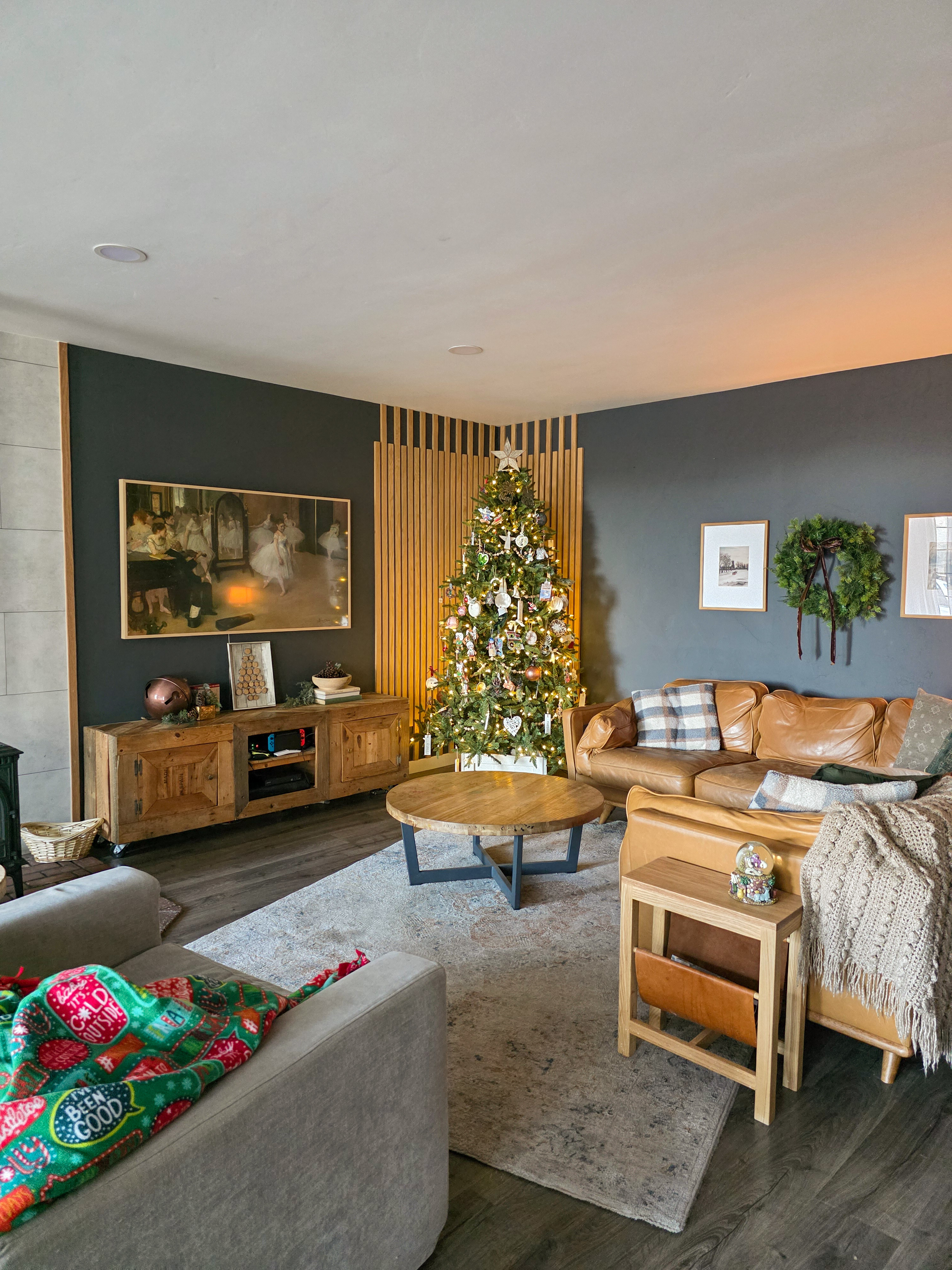 Living room dressed for December: The tree does all the magic while the sofa keeps things comfy with seasonal pillows. 

 #LTKHoliday #LTKSeasonal #LTKHome