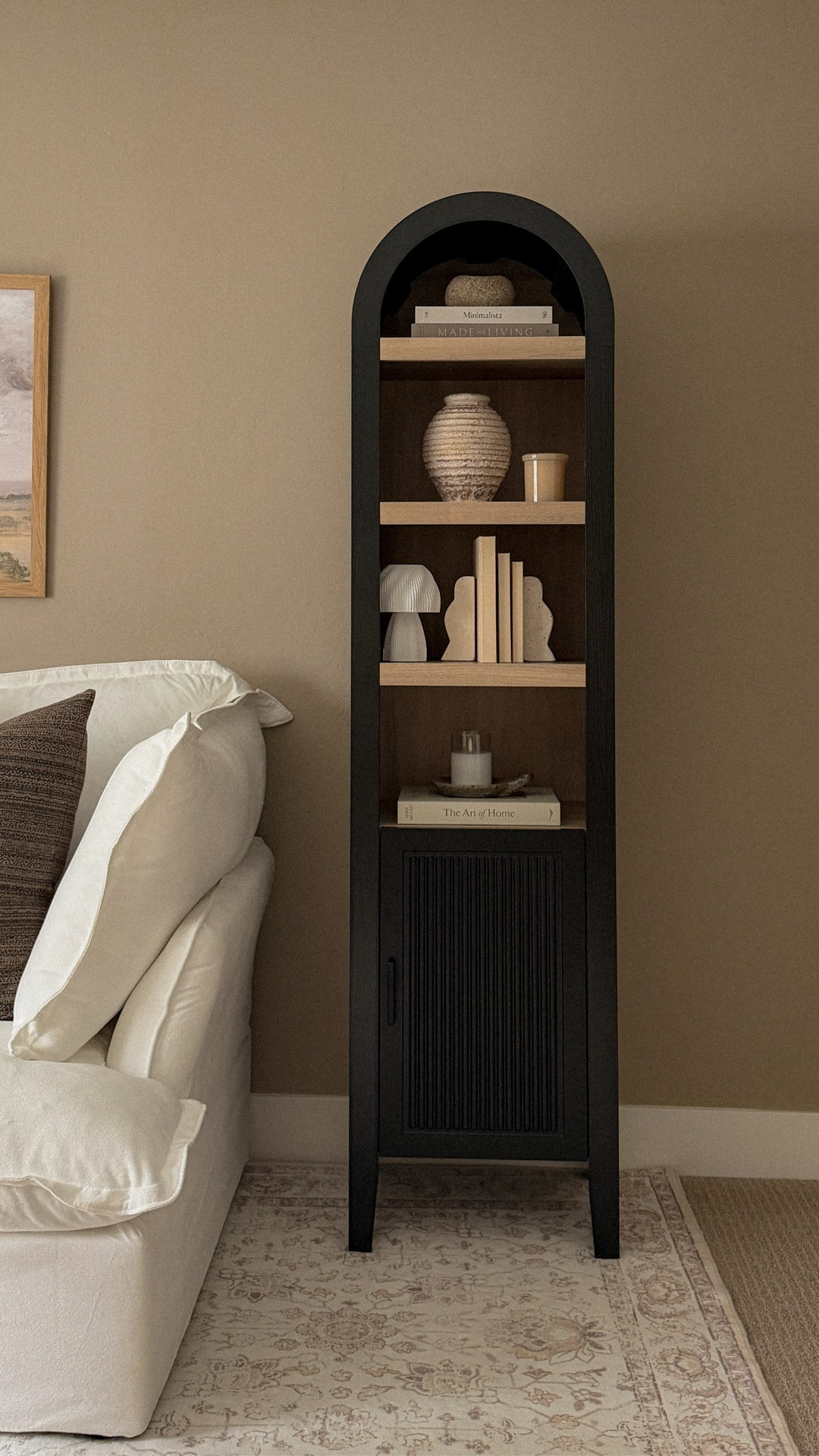 Small space, but make it designer. This arched cabinet turned an empty corner into something I actually use every day—open shelves for styling, hidden storage for the mess. It finally feels complete. 

#bcpliving #homedecor #smallspaces #neutralhomedecor  #smallhomestyle #smallstoraage

#LTKSaleAlert #LTKHome #LTKdayinmylife
