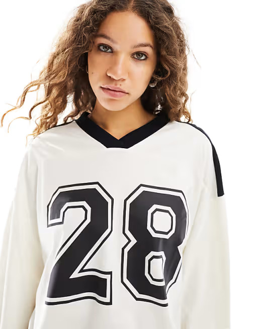 ASOS DESIGN long sleeve football tee with number 28 graphic and V-neck in ivory | ASOS (Global)