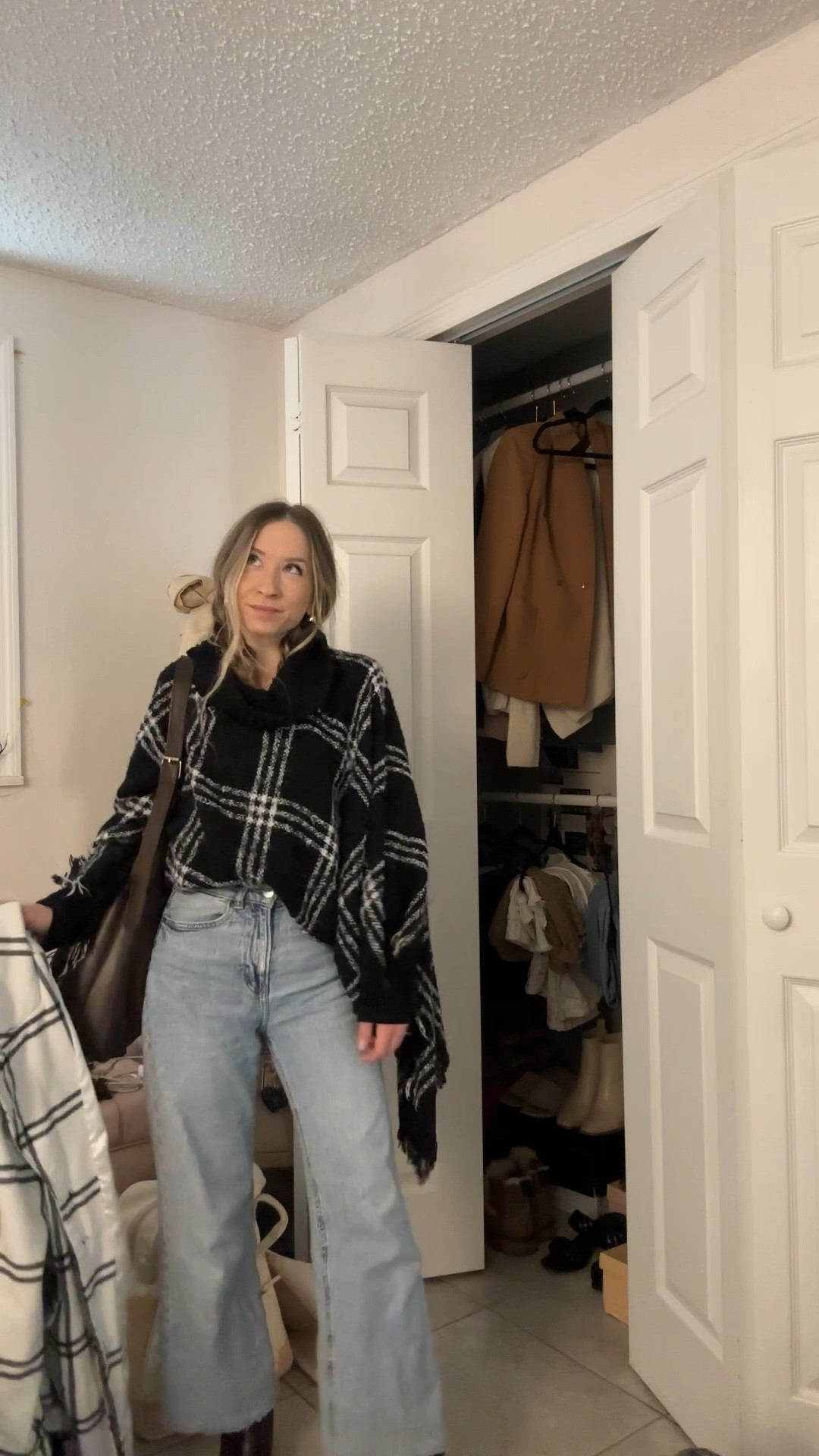 Casual winter layered outfit for the cold🖤 wearing my favorite jeans from h&m and linked similar poncho sweaters! 

#LTKootd #LTKSeasonal