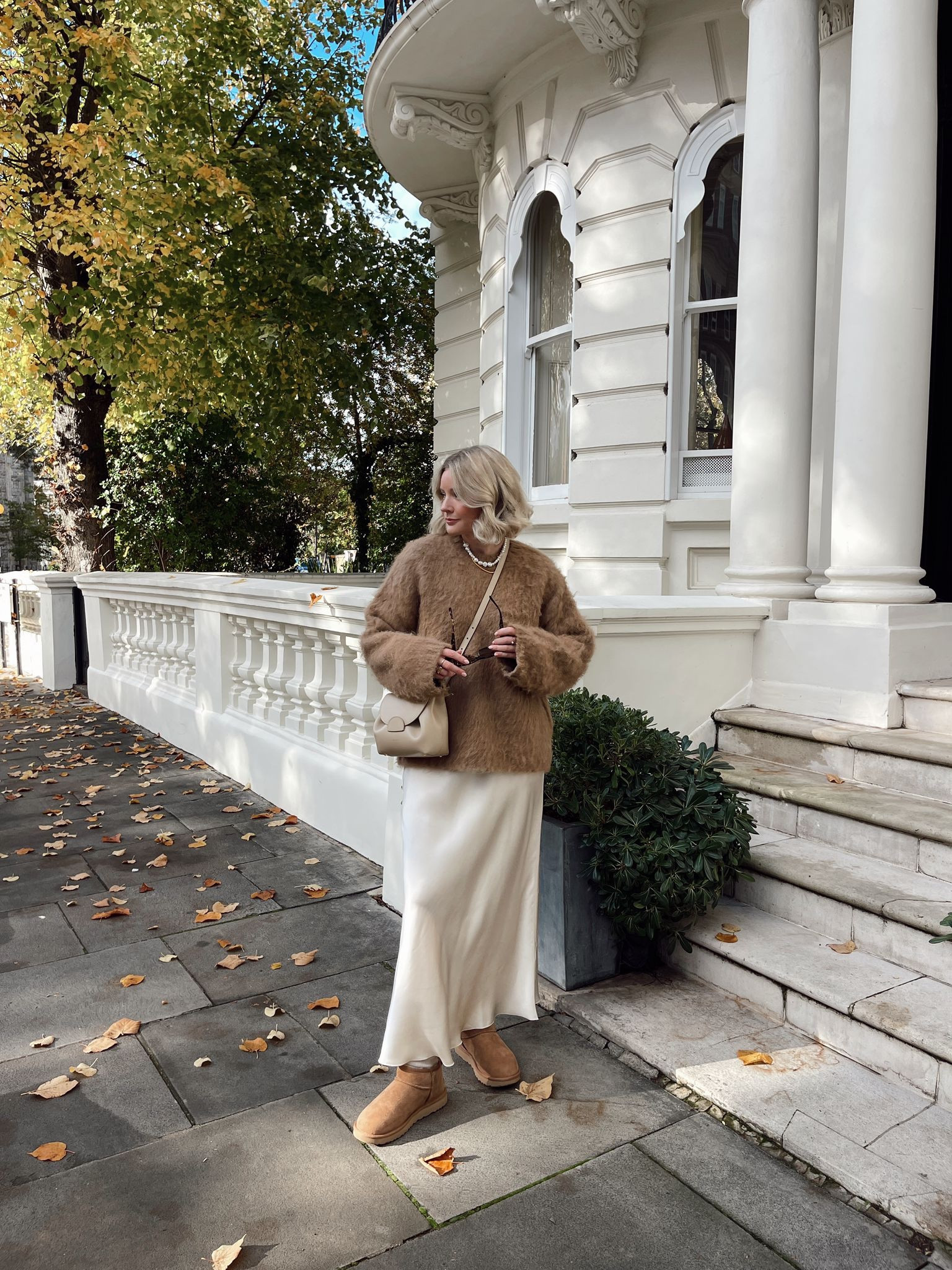 Camel brown & cream autumn outfit - H&M camel brown premium alpaca blend jumper, arket cream satin midi skirt, Ugg ultra mini boots, pearl necklace & black sunglasses  

#LTKeurope #LTKstyletip #LTKSeasonal