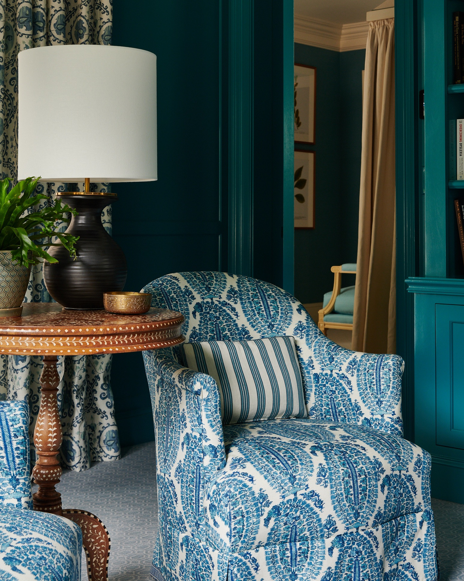 The perfect peacock blue? “Vardo” by @farrowandball is the closest we’ve found. Lacquered for added depth and shine, it sets the tone in this study just off the primary bedroom. Rich paisleys and suzani motifs complement the softer room next door, while bone-inlaid tables and a collection of inlaid wood boxes bring warmth and texture. Proof that the right color can transform a room into a world of its own.

#markdsikes #markdsikesinteriors #mdsinteriors #allinthedetails