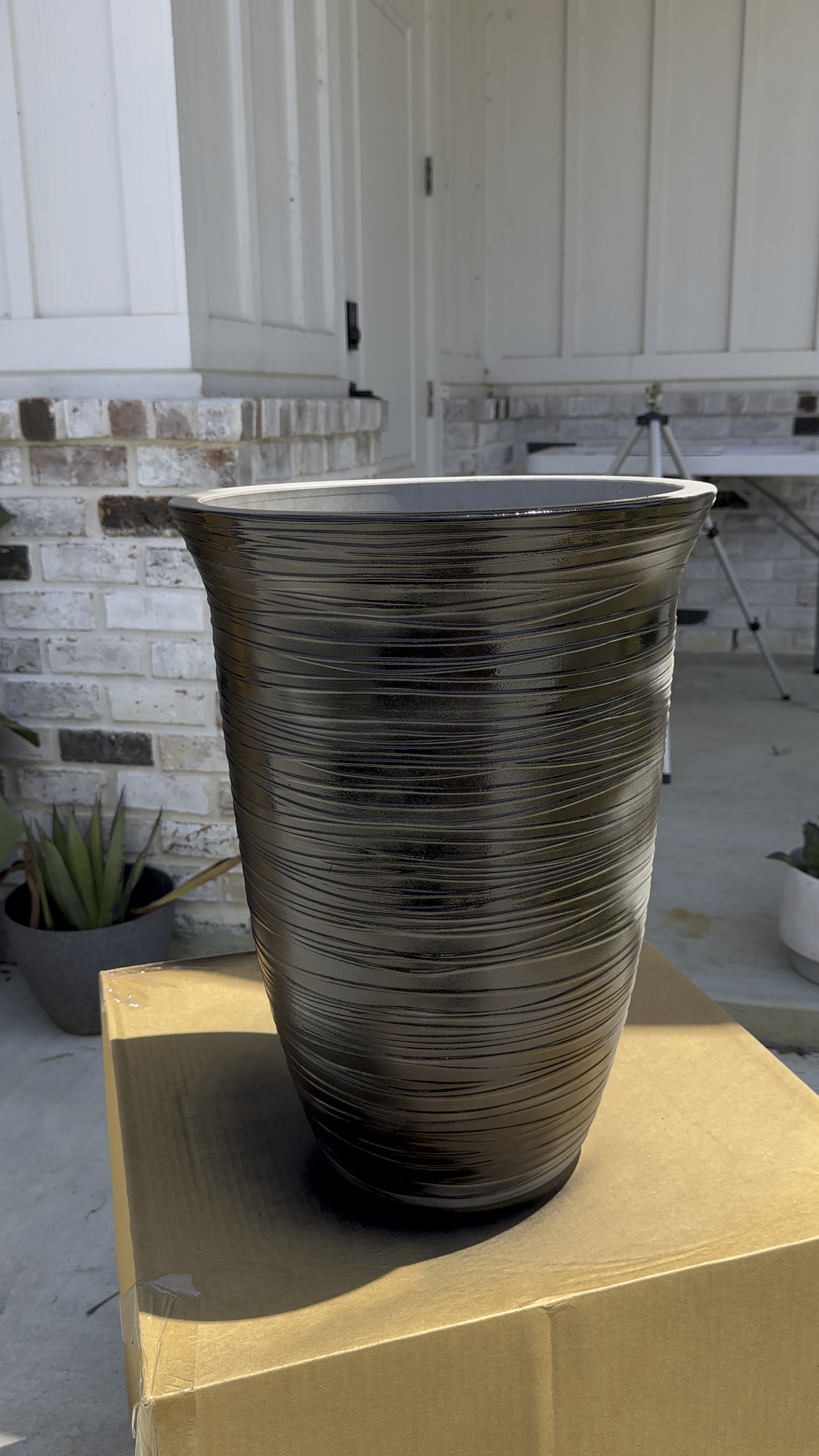 Spray painted these tall planters from Walmart black for a more modern look. These planters are the best price for how tall and big they are. Spray them any color you want! 
Walmart pot, planter pot, outdoor planter,  spray paint, tall planter, modern planter, modern home, outdoor decor, Walmart home decor, patio decor, potting mix, potting soil, dirt, garden soil.

#LTKSeasonal #LTKFind #LTKhome