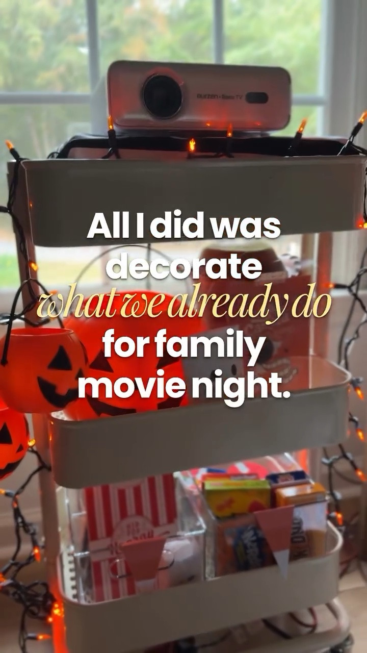 Our whole Halloween movie night rolls out on one cart. 🎃🍿

A projector up top, pumpkin buckets for the popcorn, snacks and drinks on the shelves, all on wheels. All I did was decorate what we already do for Halloween.

Traditions don’t have to start big. They just have to happen again.

What’s on your family’s movie night snack list?