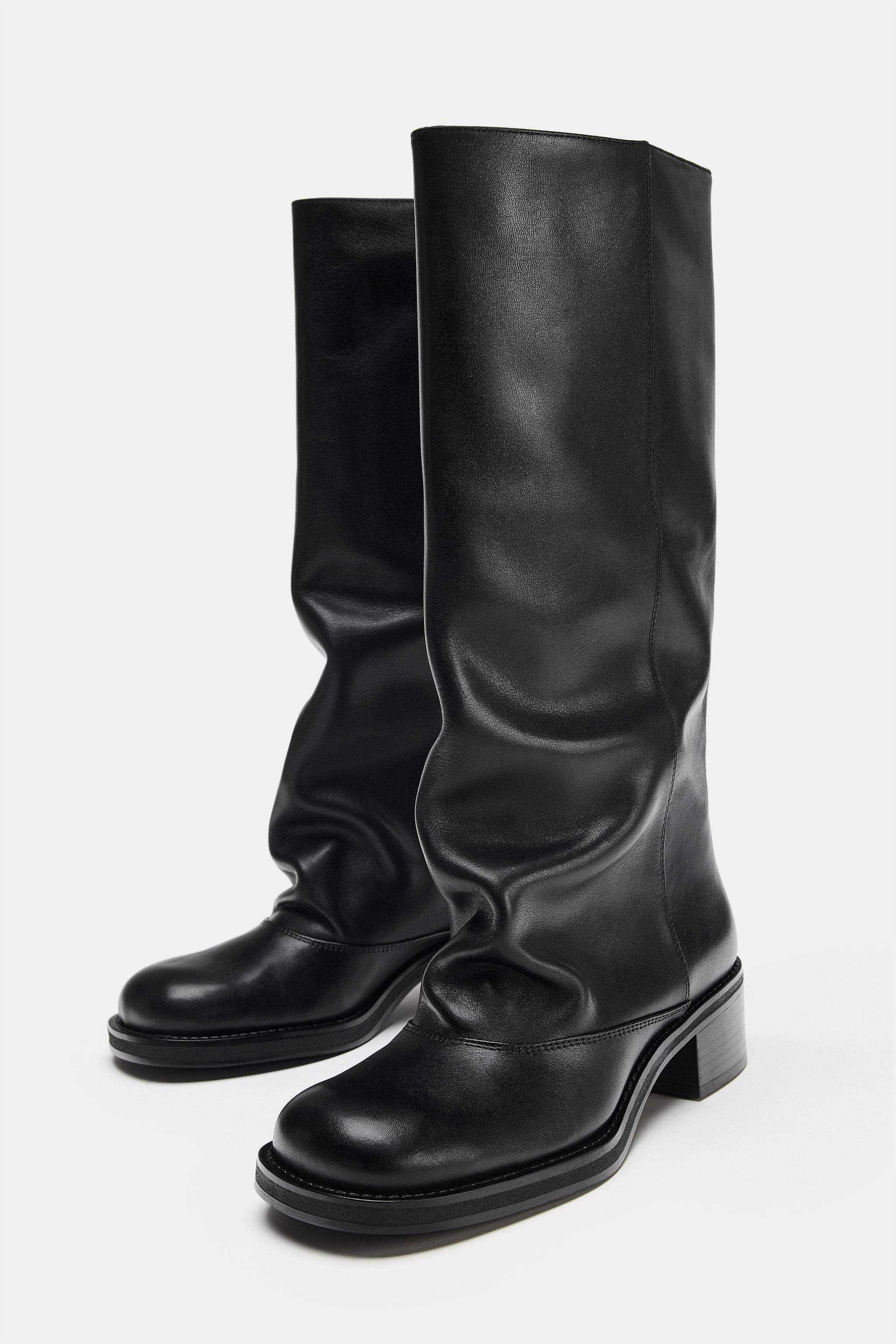 Leather knee-high boots. Biker style. Slouchy leg. Pull-on style for easy fit. Semi-square toe.He... | Zara DE