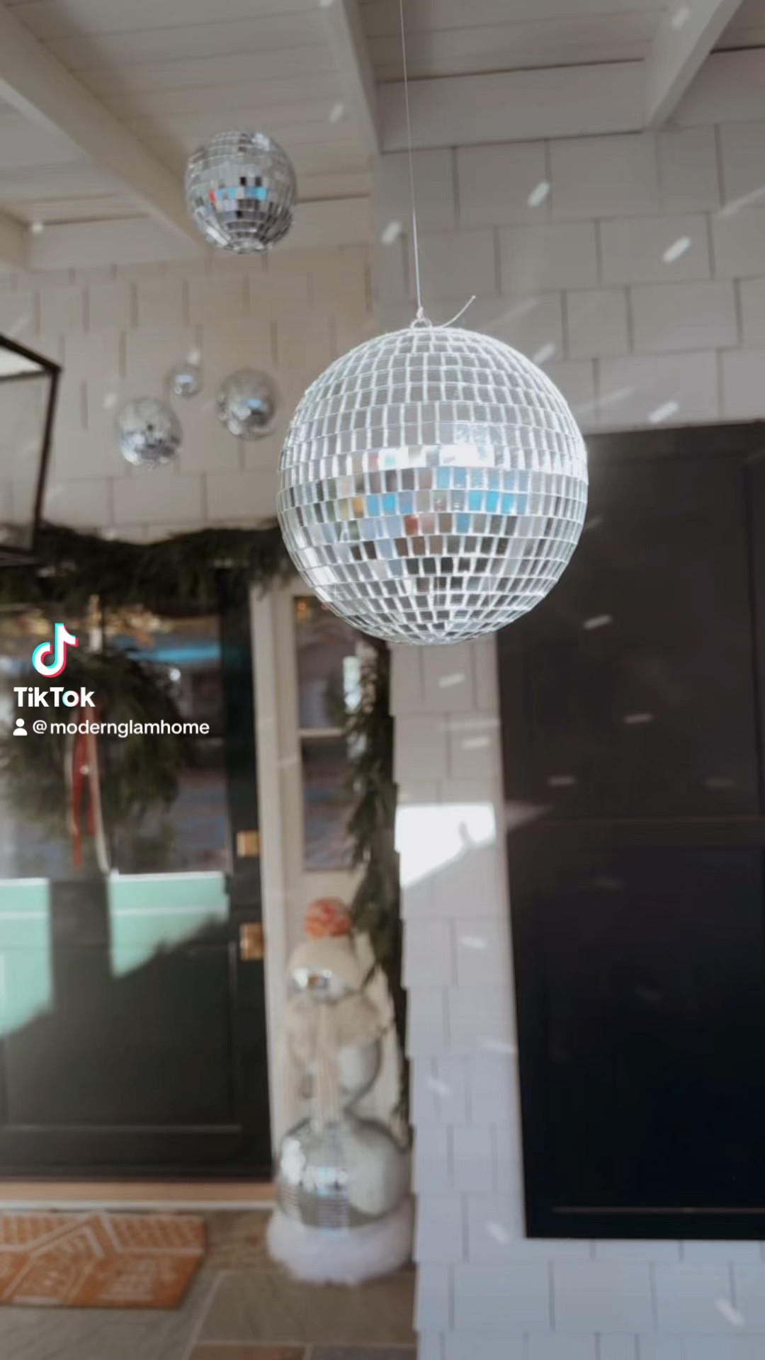 Links to the most realistic garland and wreath that I used on my disco porch 