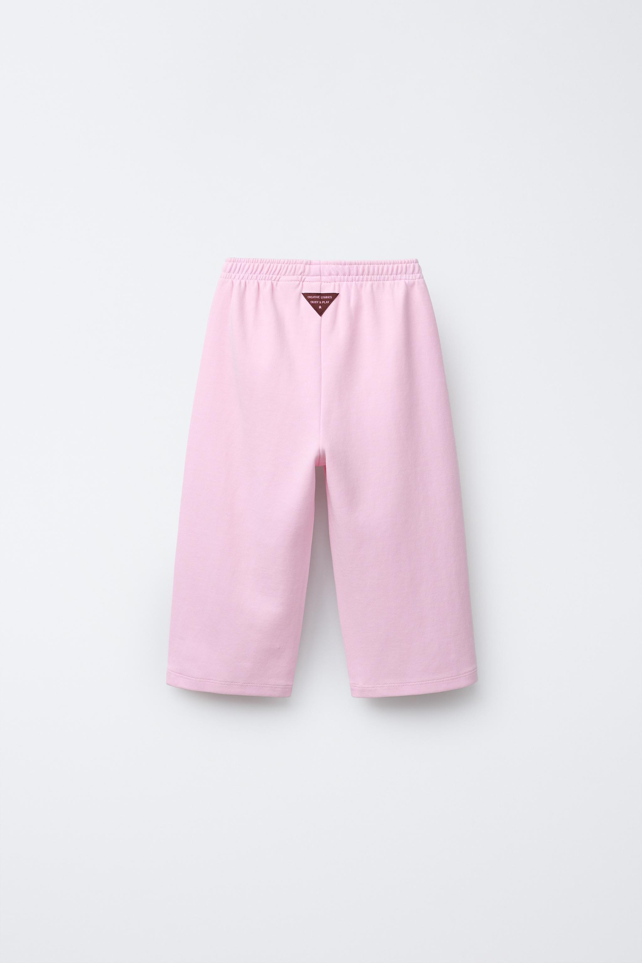 Wide-leg trousers with an elasticated waistband and a label appliqué on the back. | Zara UK