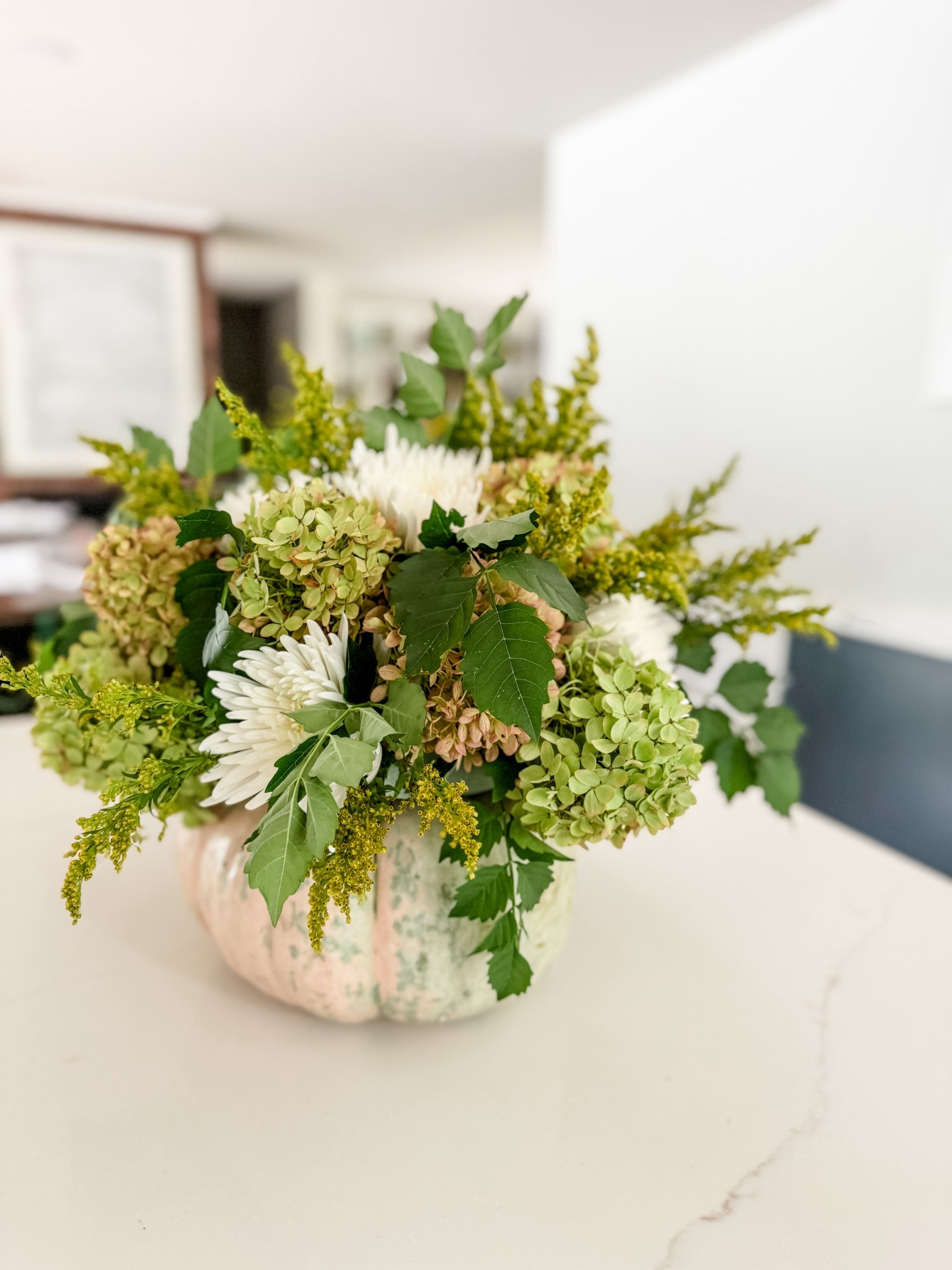Easy Fall Floral Arrangement! SEND this post to your friend who loves fall and florals!  I picked up a pumpkin and flowers at the grocery and used a piece of floral foam to create this unique fall centerpiece. It’s an easy DIY that looks like it’s from a high end florist. I used some hydrangeas and foliage from our yard to add extra dimension and depth. Save this idea for your next gathering!

fall floral arrangement, easy fall centerpiece, diy pumpkin floral, fall home decor ideas, grocery store floral diy, budget friendly fall centerpiece, pumpkin flower arrangement, fall decorating inspo, diy fall table decor, hydrangea centerpiece, unique fall floral, easy fall diy, seasonal centerpiece ideas, fall entertaining decor, autumn floral arrangement, cozy fall table decor, high end look for less centerpiece, diy floral foam arrangement, backyard foliage arrangement, fall hosting favorites, diy fall flowers, rustic fall centerpiece, amazon fall home finds, festive fall floral ideas

#LTKHome #LTKParties #LTKSeasonal