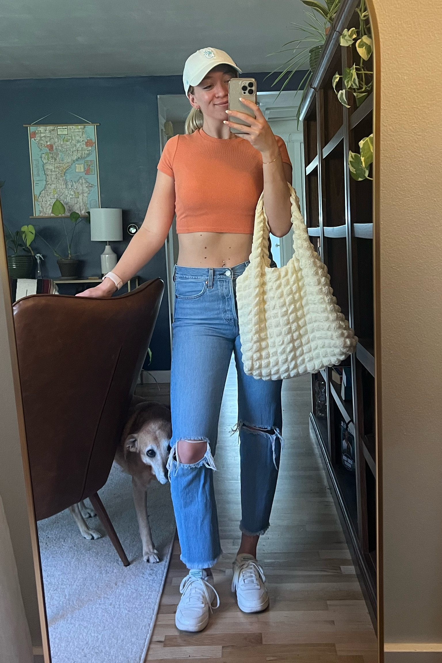Errands outfit! Easy weekend outfit in my garage orange crop top, ripped jeans, white sneakers, and white baseball hat with a tote bag! 

Spring outfit, summer outfit, Levi jeans, ripped jeans, crop top, sale jeans

#LTKfindsunder100 #LTKSeasonal