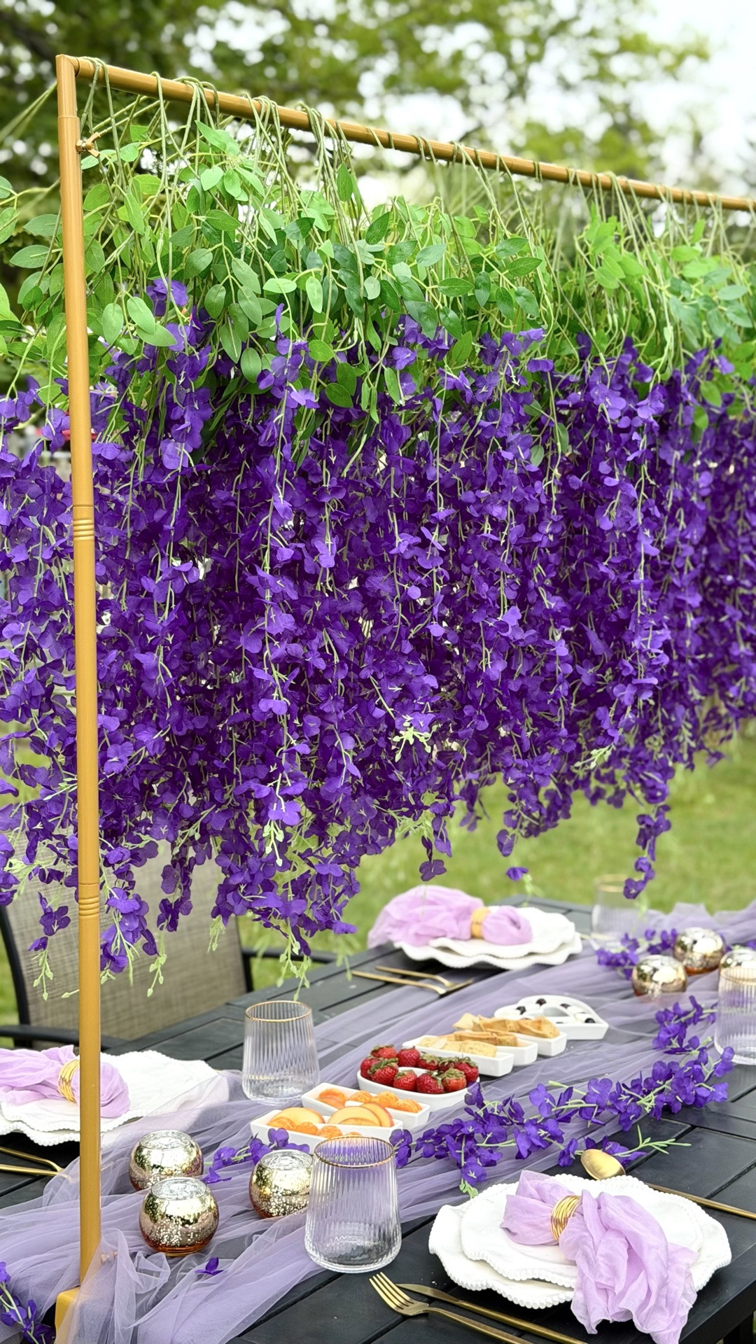 . I’m sharing easy, elegant DIY hosting ideas to make your brunch feel magical. It’s dreamy & the perfect garden-party vibes for Mother’s Day—soft florals, golden glow, and a table set to celebrate the season of motherhood. Pieces I have used are wisteria garlands, purple table runner, spring plates, gold flatware, gold‑rim wine glasses, lavender napkins + gold rings, “MOM” snack board, gold tea‑light holders. #MothersDay #DIYHosting #HostingTips #BrunchTablescape #TableSettingIdeas

#LTKMothersDay #LTKmomlife #LTKHome