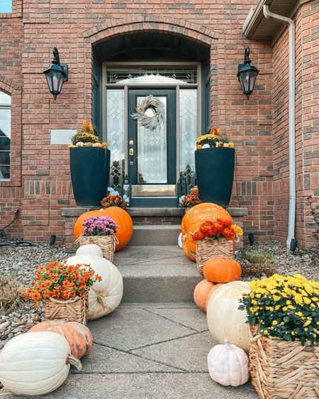 Our 2023 fall front porch 🍂🧡🍁

Fall front porch. Fall decorations. Fall porch. Fall home decor. Front porch decor. Planters. Mum baskets. Faux mums. Faux pumpkins. Porch pumpkins. Flower arrangement. Fall wreath. Amazon finds. Pumpkins. Home styling. Curb appeal. Front porch steps. Brick house decorations. Brick house porch. 

#LTKSeasonal #LTKhome