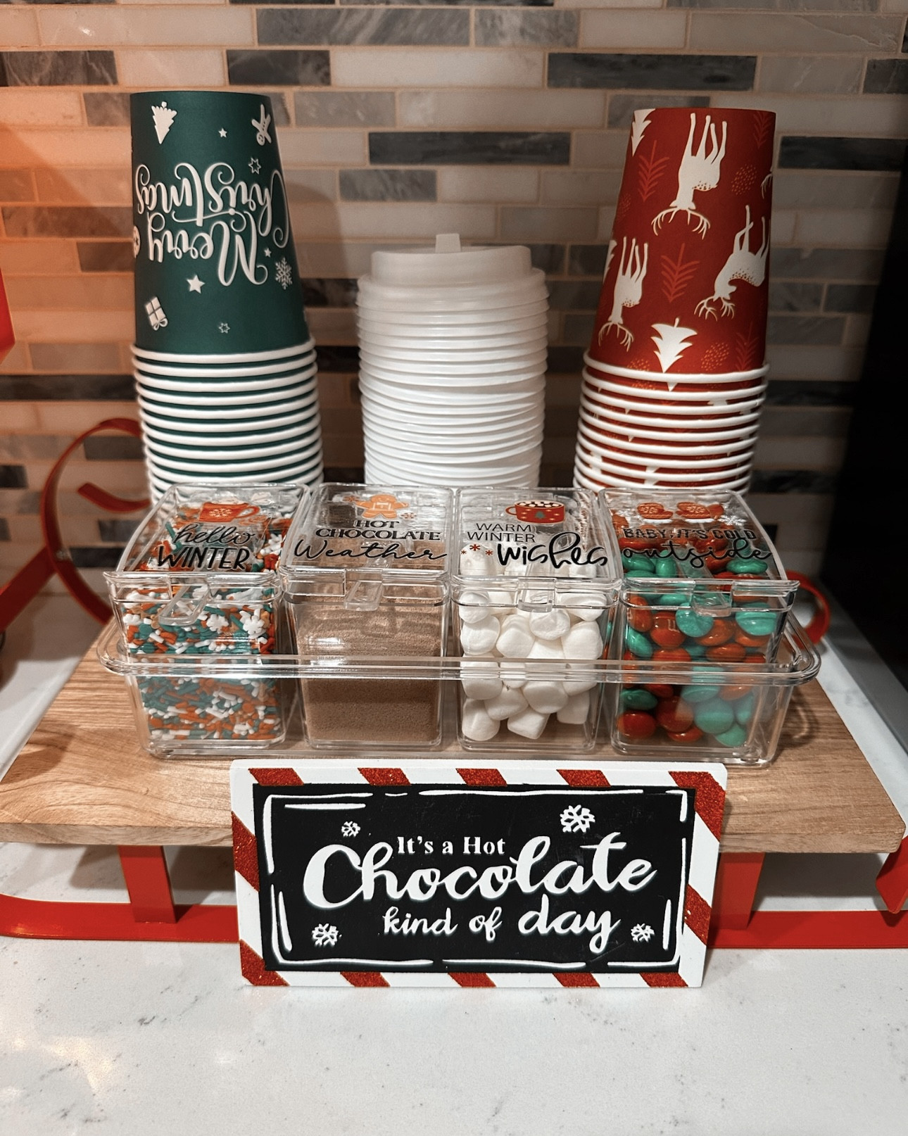 Christmas Holiday Hot Chocolate Cocoa Bar Station ⛄️❄️☕️

Holiday thermal paper cups, LED Santa stop here tabletop sign, mini sleigh, hot chocolate k-cups, clear acrylic topping container with mini scoopers, holiday sprinkles 

🛒 AMAZON & TARGET 

#LTKHoliday #LTKKids #LTKmomlife