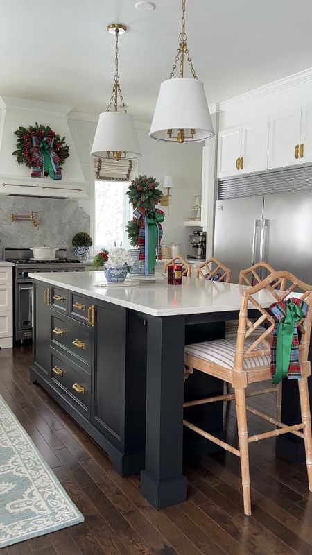 Our Christmas kitchen! Chic greenery, topiaries and paid ribbon make a traditional and elegant statement

#LTKhome #LTKstyletip #LTKHoliday