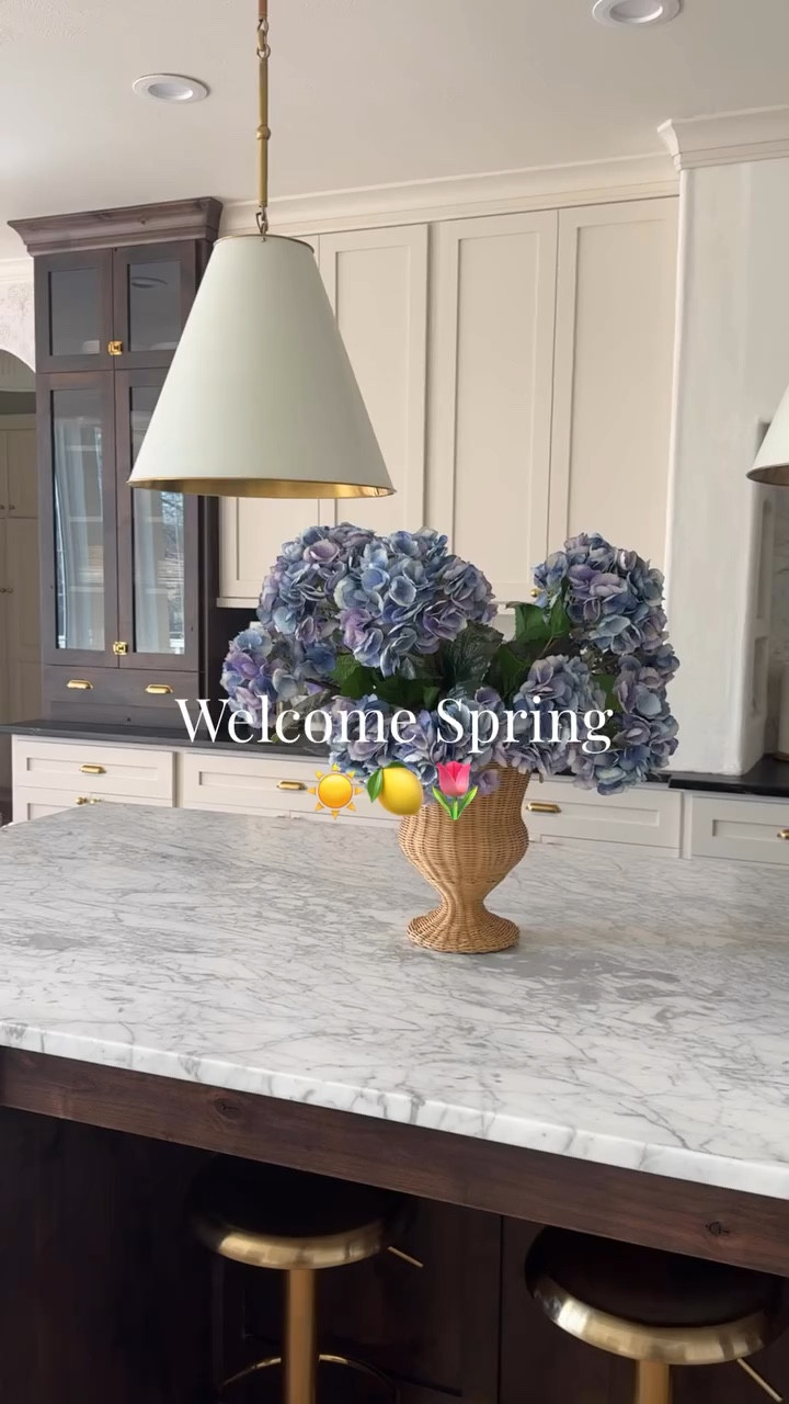 Welcoming spring in my home 🌷🍋💧 Embracing lighter fabrics, mixing prints and adding all the pops of blue around my home! Looking forward to many nights spent on our porch and opening the pool soon!  Follow along @ourmountainsidehome_1 if you love a classic home interior!  Spring, spring home, spring home decor, face florals, porch, outdoor seating, spring bedroom, white and blue, spring kitchen, neutral kitchen, Nancy Meyers home aesthetic, Ralph Lauren home, colonial home #nancymeyersinteriors #springhomedecor #porchdecor #luxurykitchen #homedecor