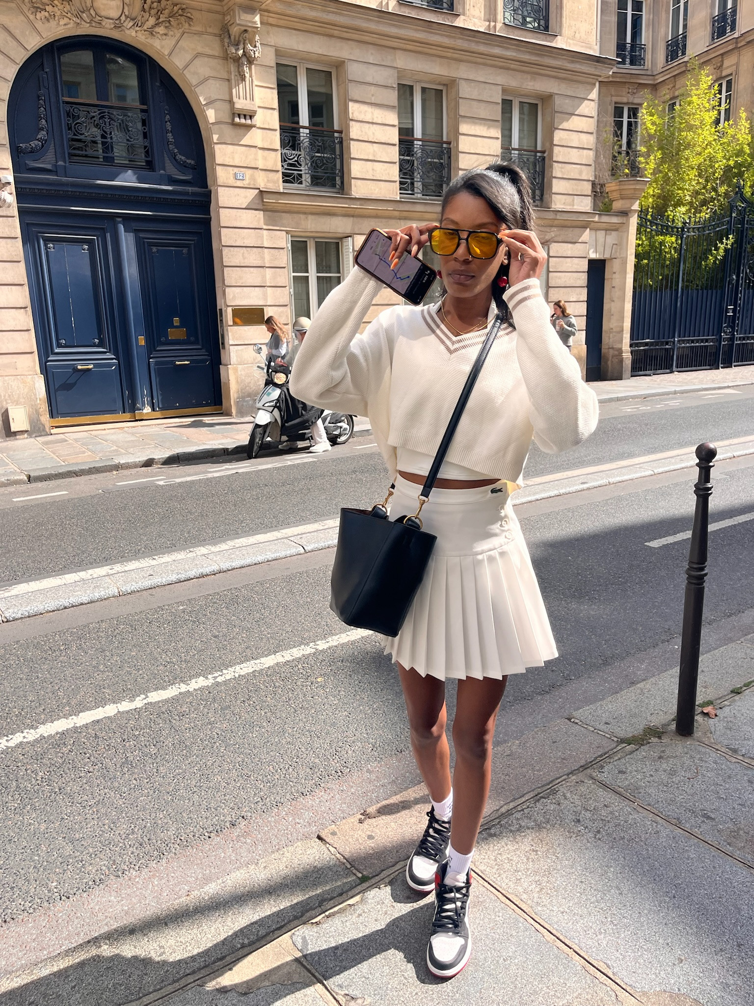 Tennis fit for a day watching matches in Paris
✨Sweater - Alo size small
✨Skirt - Lacoste pleated twill skirt small
✨bag - Zara bucket bag
✨shoes - satin toe Jordan’s 
✨glasses - orange aviators

#LTKShoeCrush #LTKStyleTip #LTKTravel