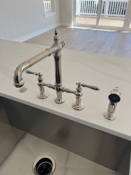 Polished nickel kitchen sink bridge faucet. 

#LTKhome