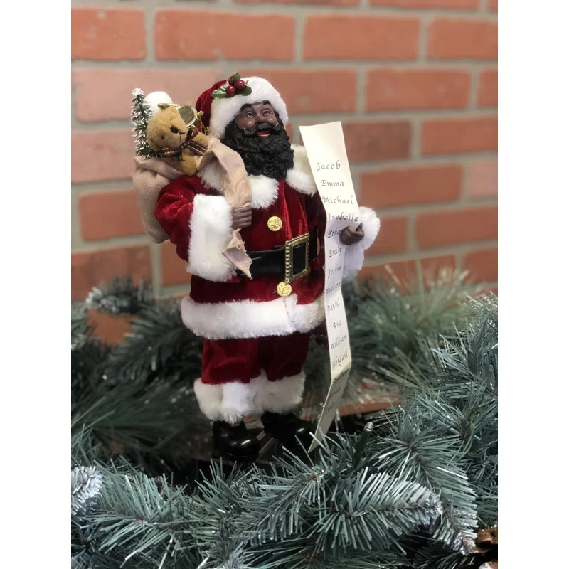 The Holiday Aisle® African American Santa with His List Figurine & Reviews | Wayfair | Wayfair North America